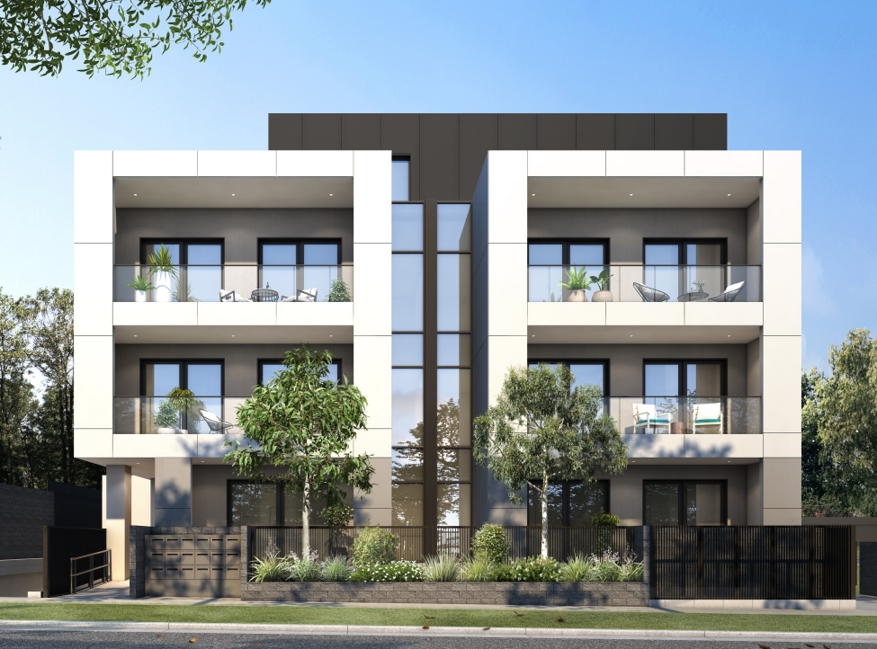 Modern multi-story apartment building with balconies and glass railings, surrounded by landscaped greenery and trees, under a clear blue sky.