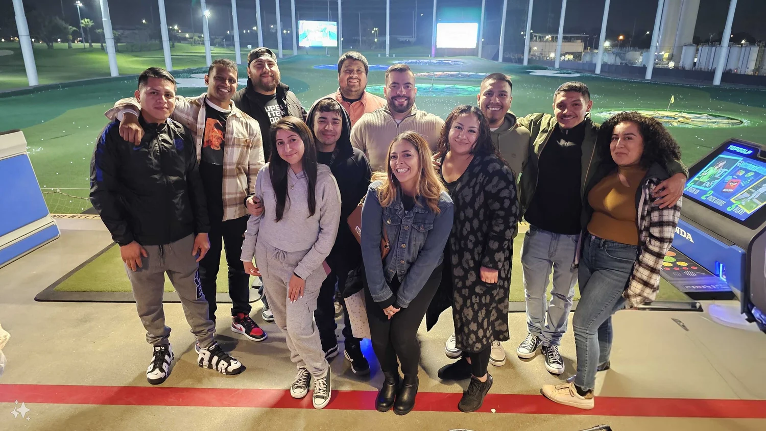A group of young adults posing together