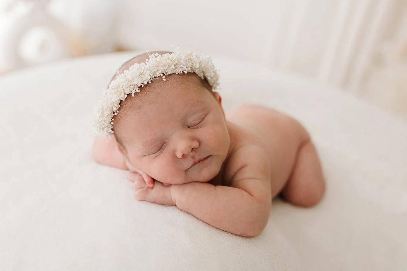Newborn baby sleeping peacefully on tummy in natural light photography studio on Melbourne's North East