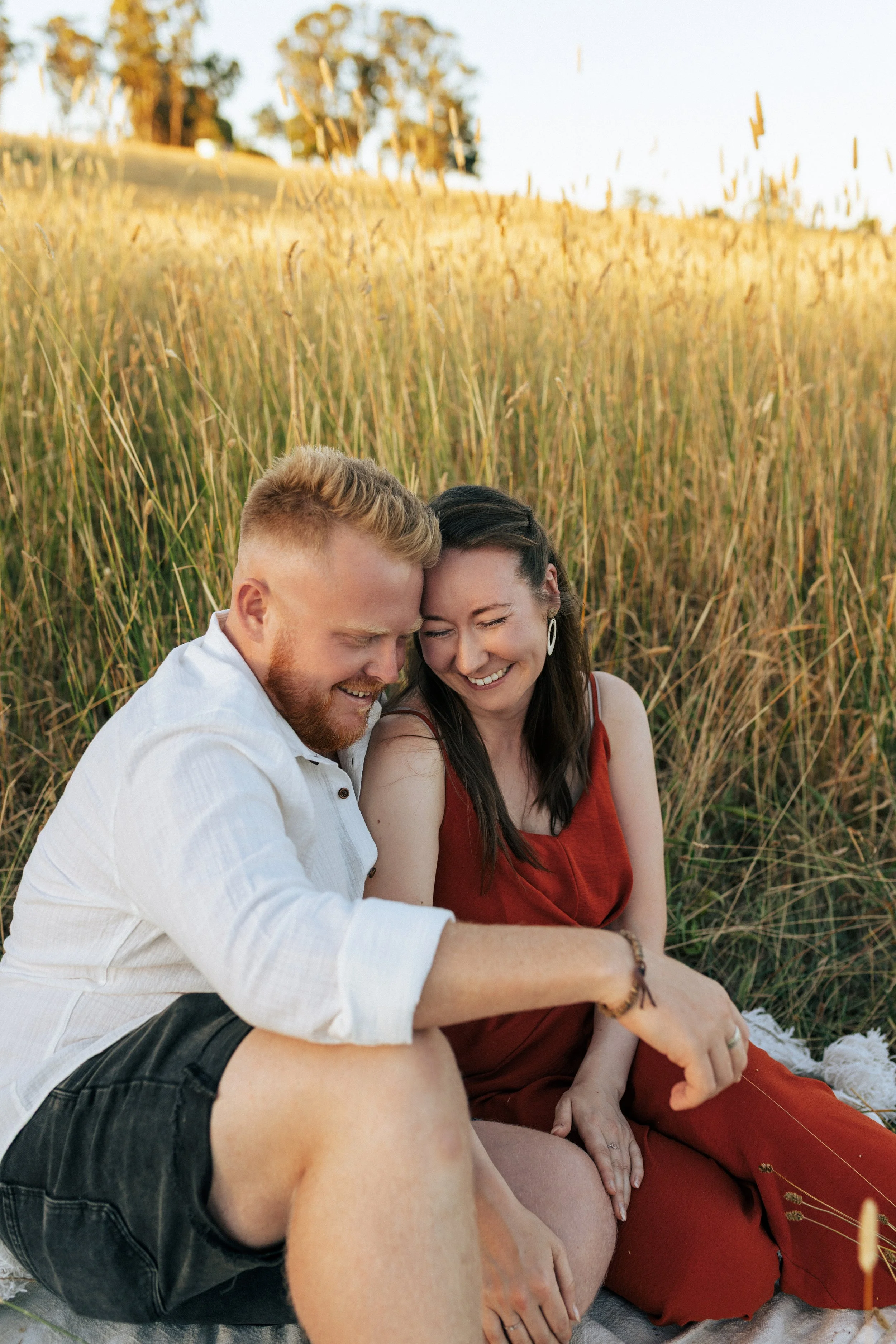 Couple embracing during a relaxed outdoor photography session