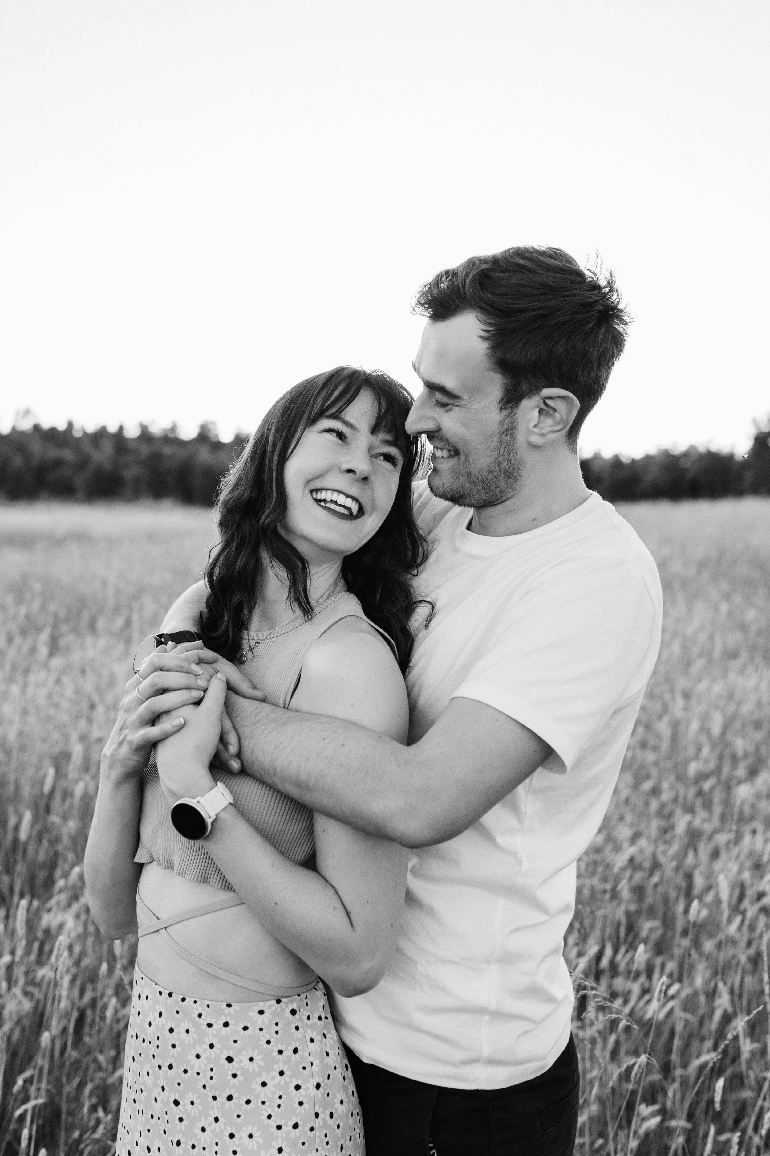Couple embracing and laughing