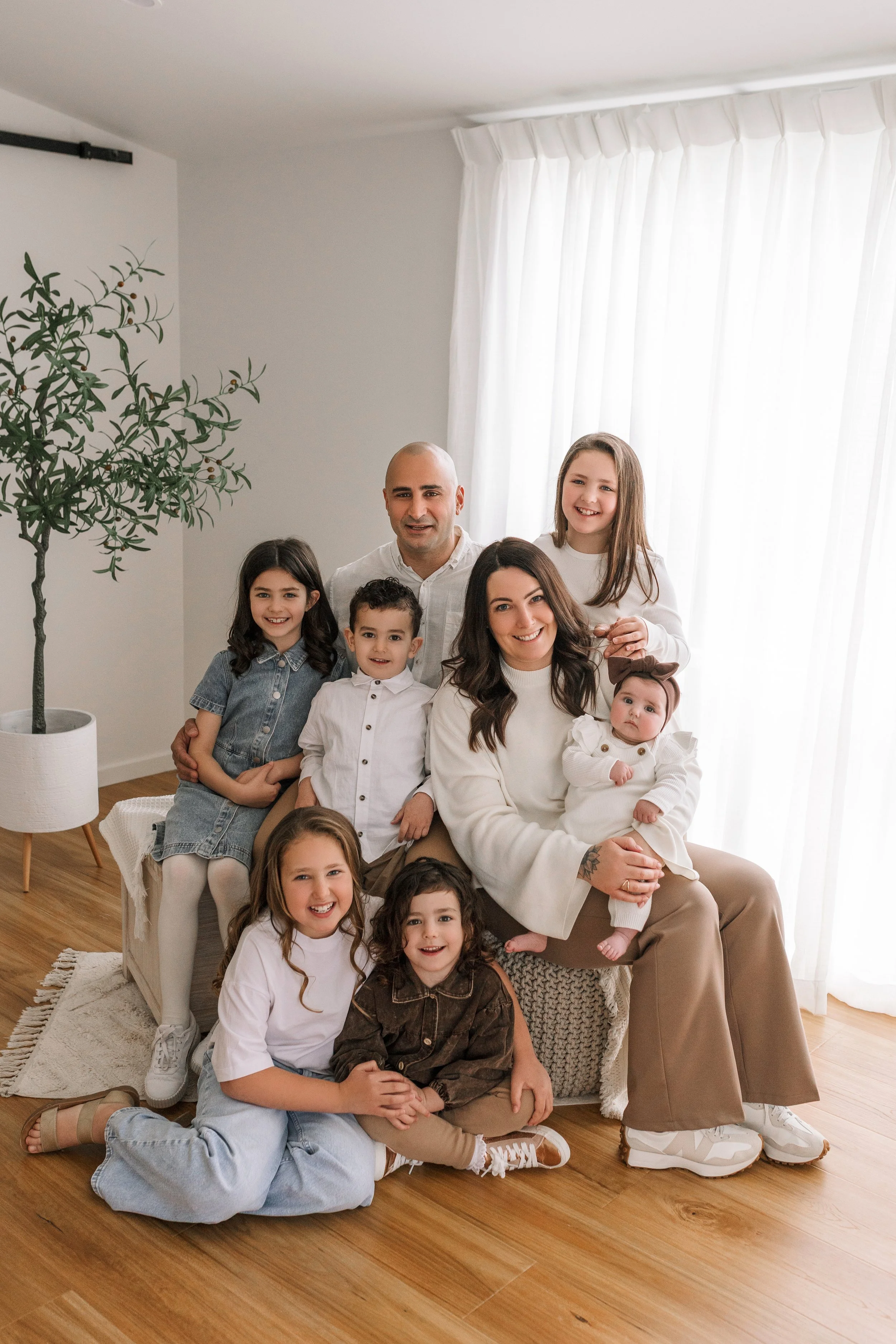 Posed family portrait in natural light photography studio
