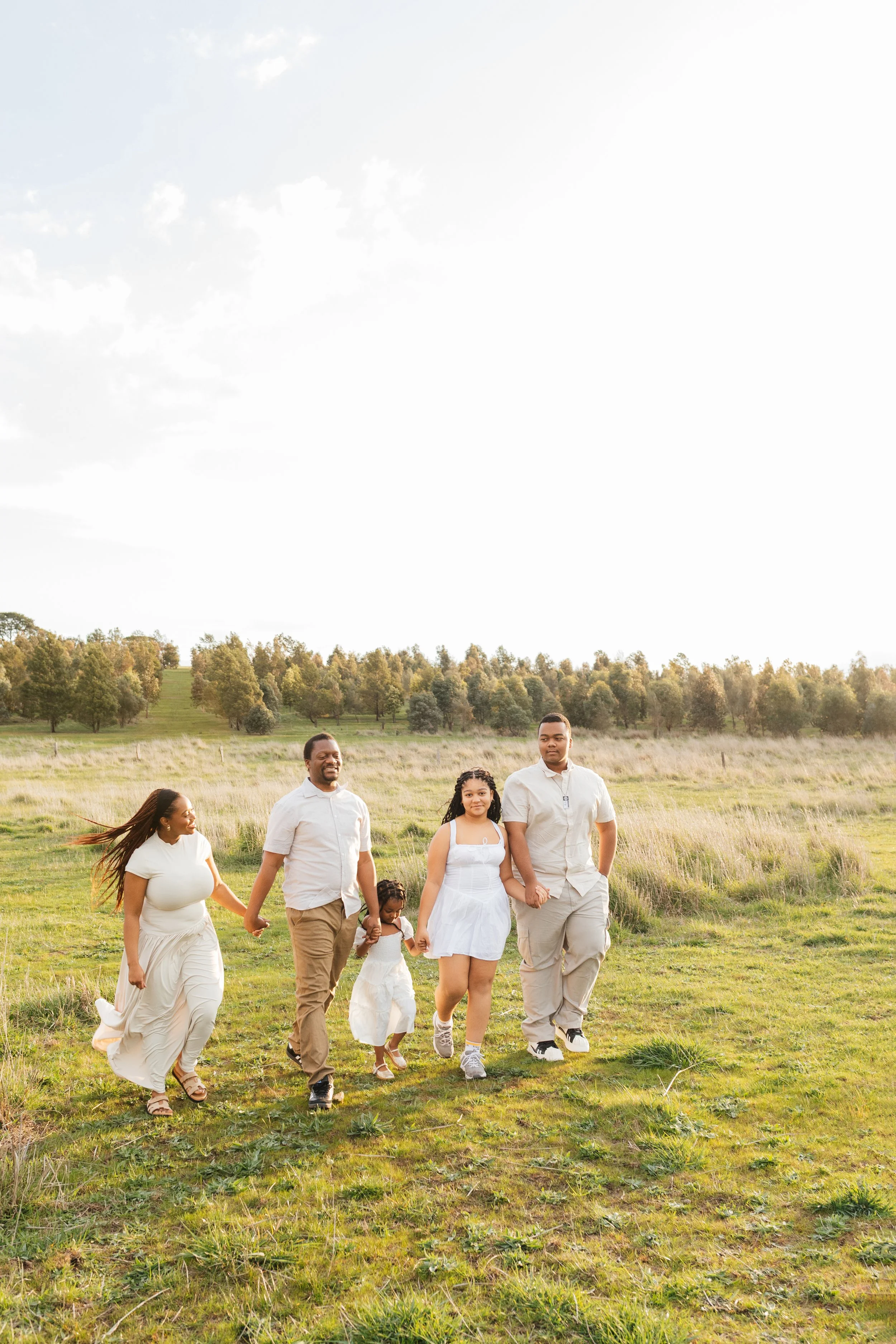 Family laughing together during a golden hour photoshoot in Melbourne's North East