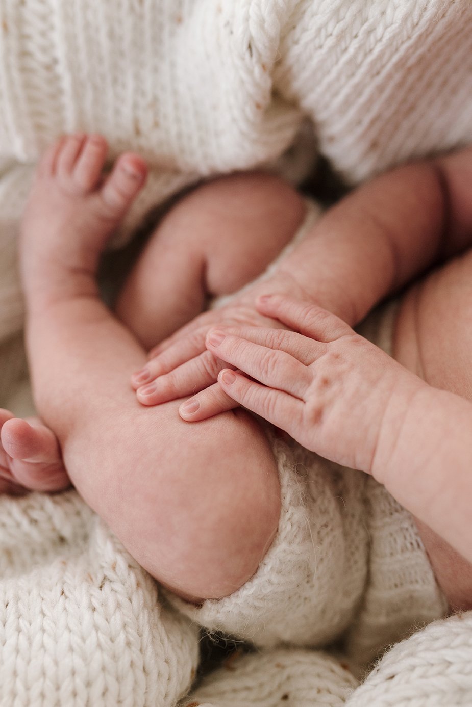 Close up image of newborn baby's tiny fingers