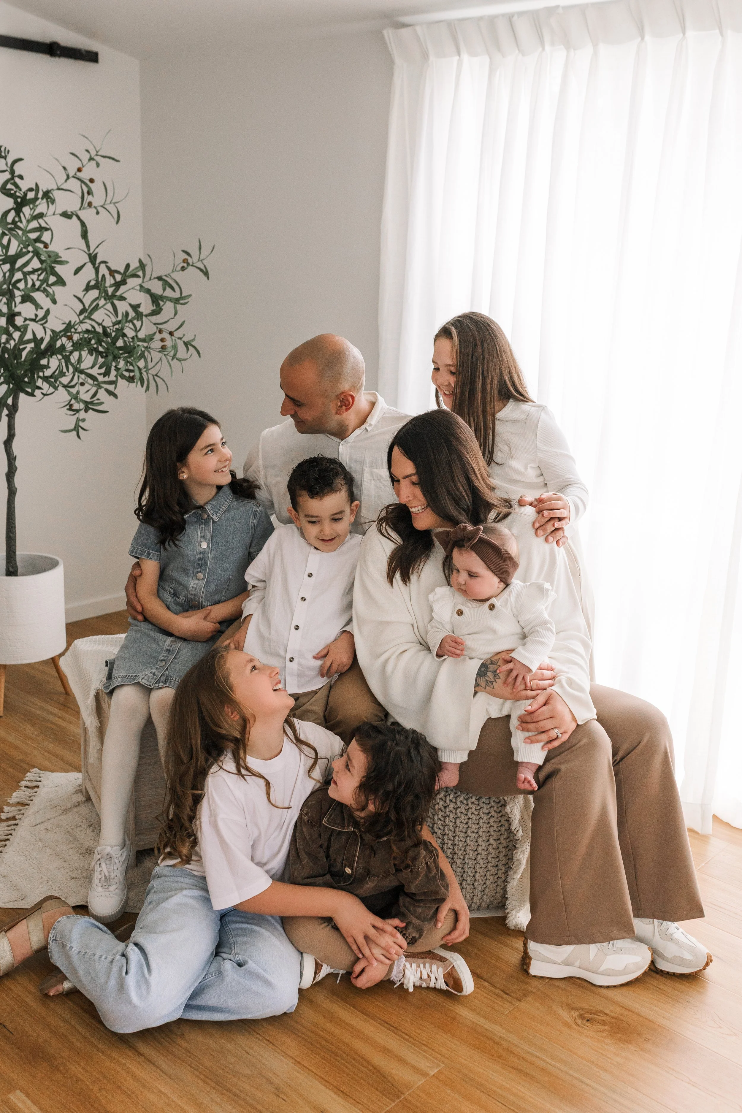 Parents holding their children during a relaxed family portrait session