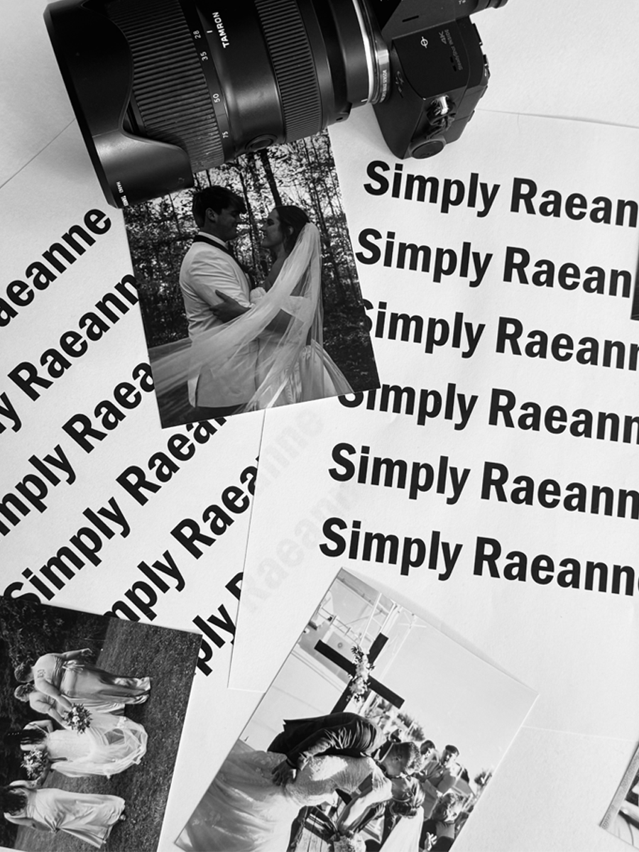 A collage of wedding photos, including a black-and-white portrait of a bride and groom, with a camera and multiple sheets of paper with the text "Simply Raeann" repeated, and other wedding scenes.