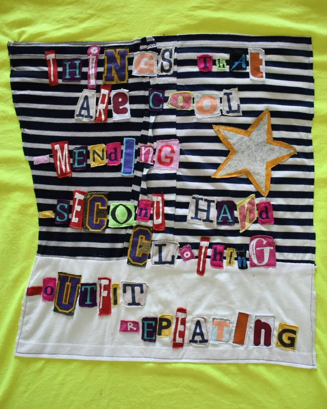 Things that are cool 
-mending 
-second hand clothing 
-outfit repeating 

Hand drawn cartoon with fabric marker on reclaimed tee to cover stains. Hand sewn speech bubble and patch over stain and machine sewn text collage on back ✨ 

One of a kind, r