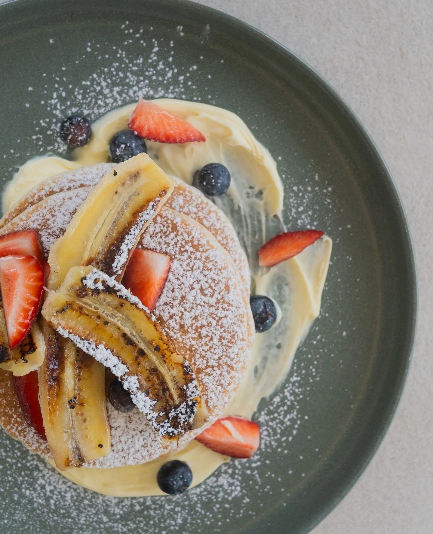 For those who love a touch of sweetness in the morning, have you tried our pancake stack? Fluffy, golden layers topped with fresh berries, grilled banana, silky mascarpone, maple syrup &amp; butter.
