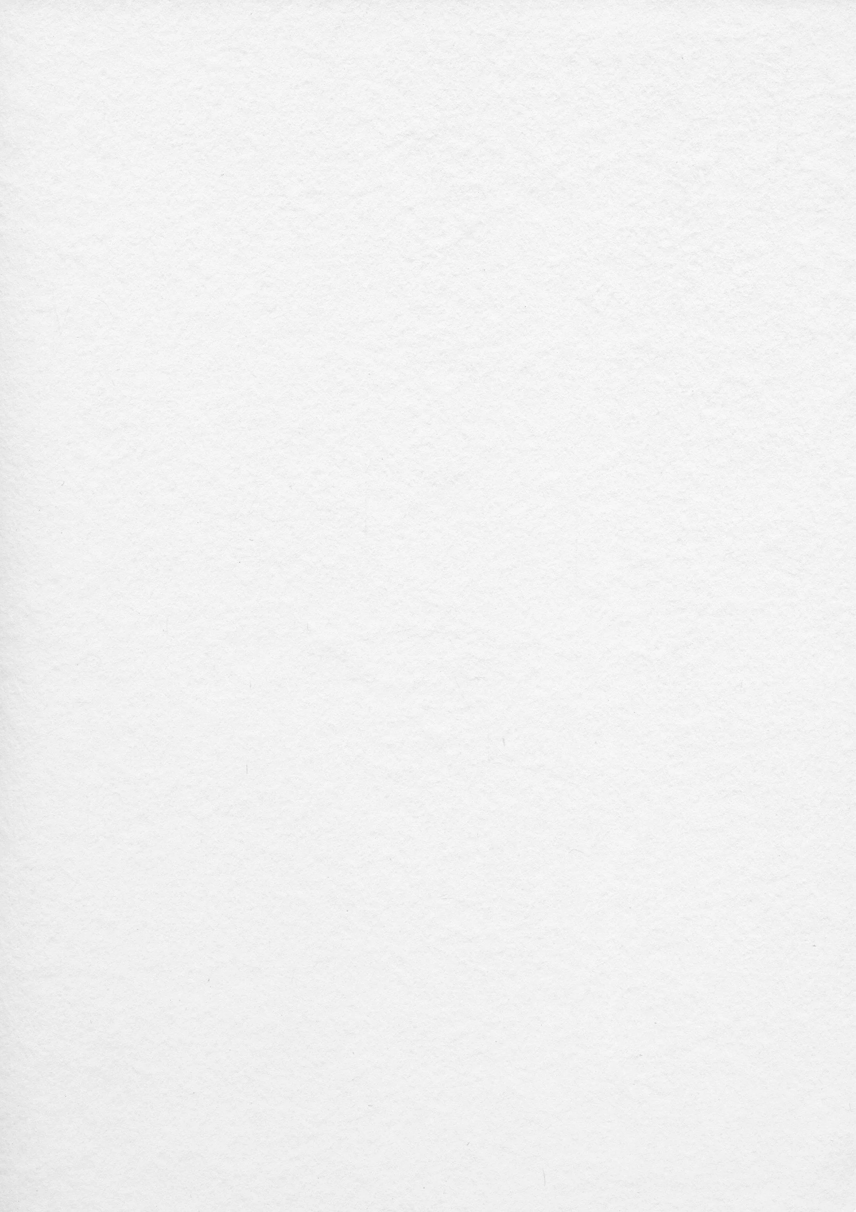 Scenic landscape of a mountain range with green hills and a lake in the foreground under a cloudy sky.