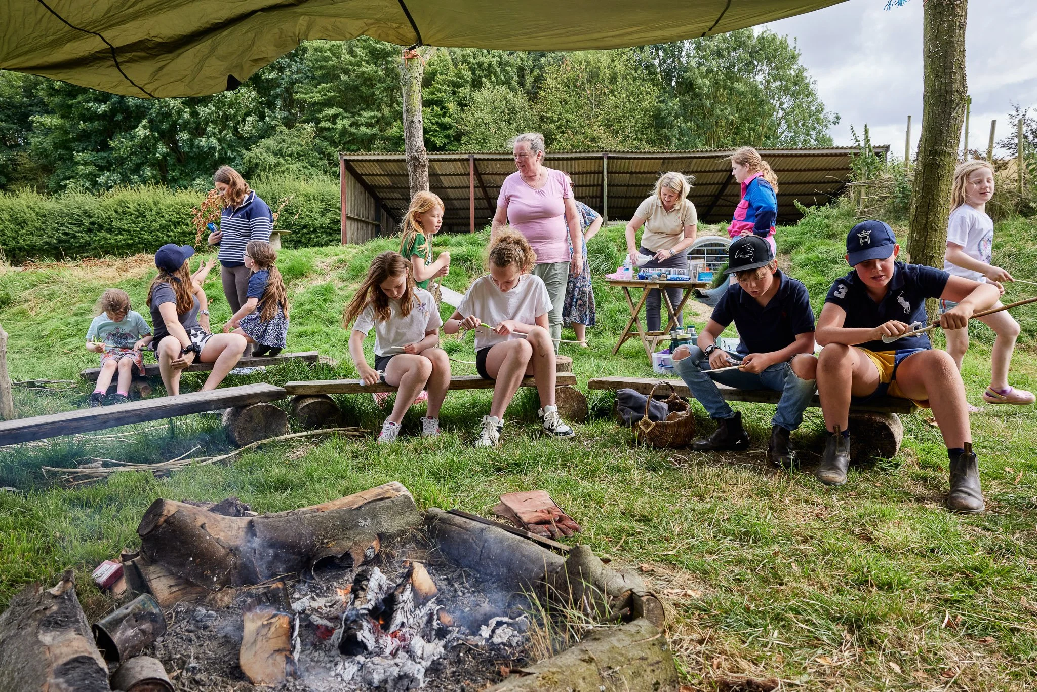 Children sat around campfire