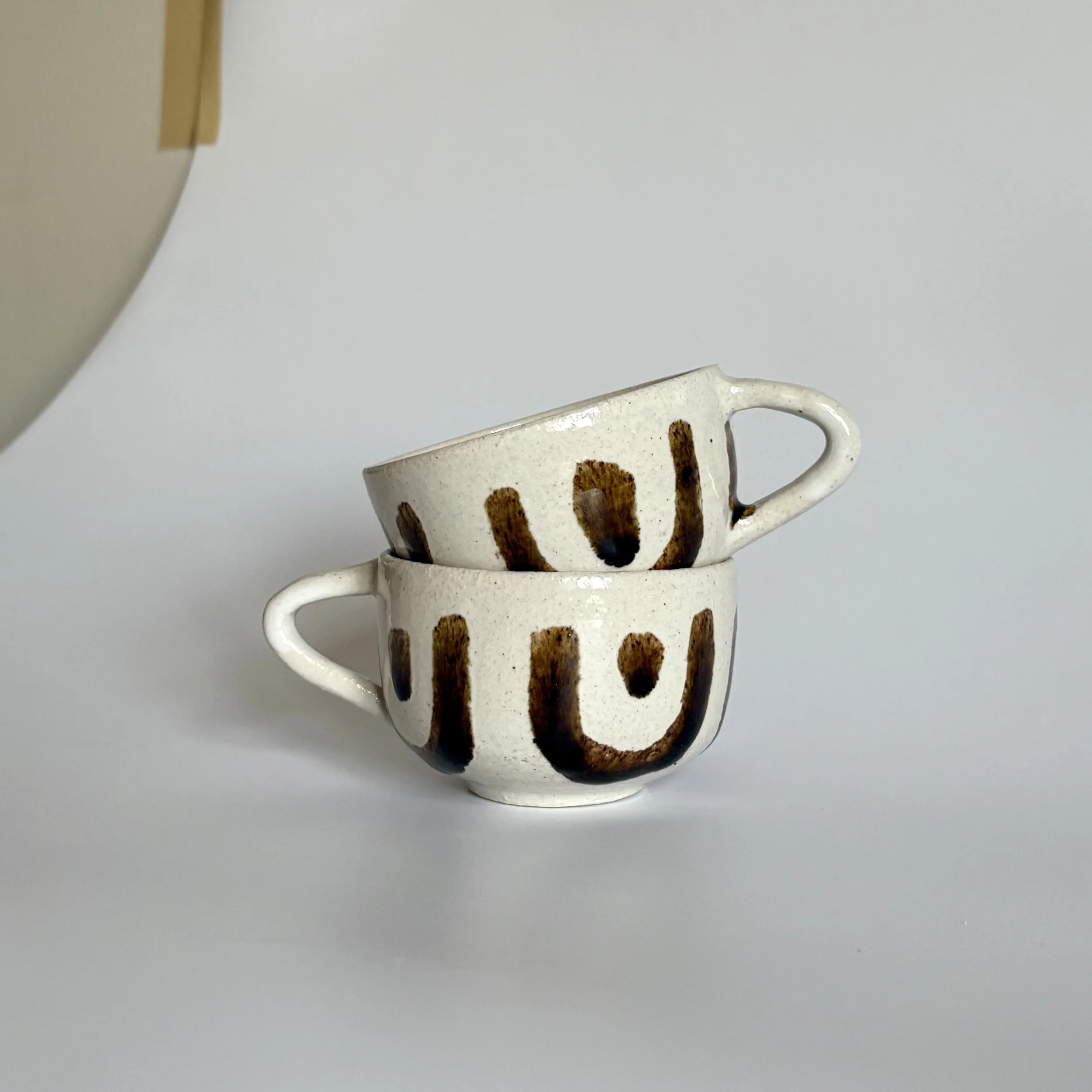 frank coffee cup stack.jpg