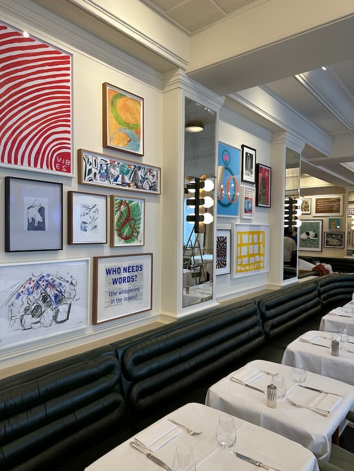 Gallery wall installed above bank seating in the ground floor restaurant.