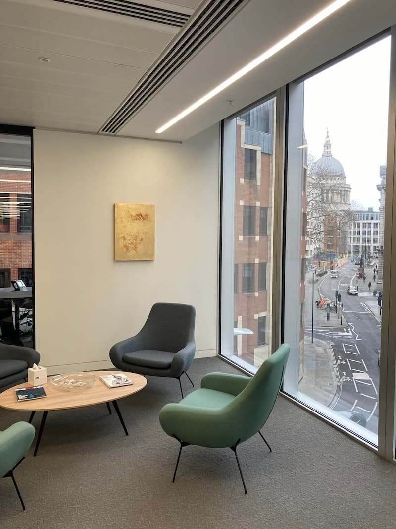 Corporate art installation in a Marylebone office; 100+ artworks transported, stored, and installed with security fixings by Gilbert Art Services.