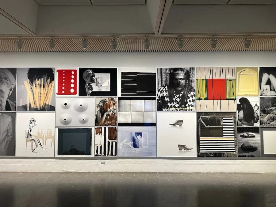 Museum-standard art hanging for a commercial gallery space in Mayfair, featuring perfectly aligned artworks in a salon hang style.