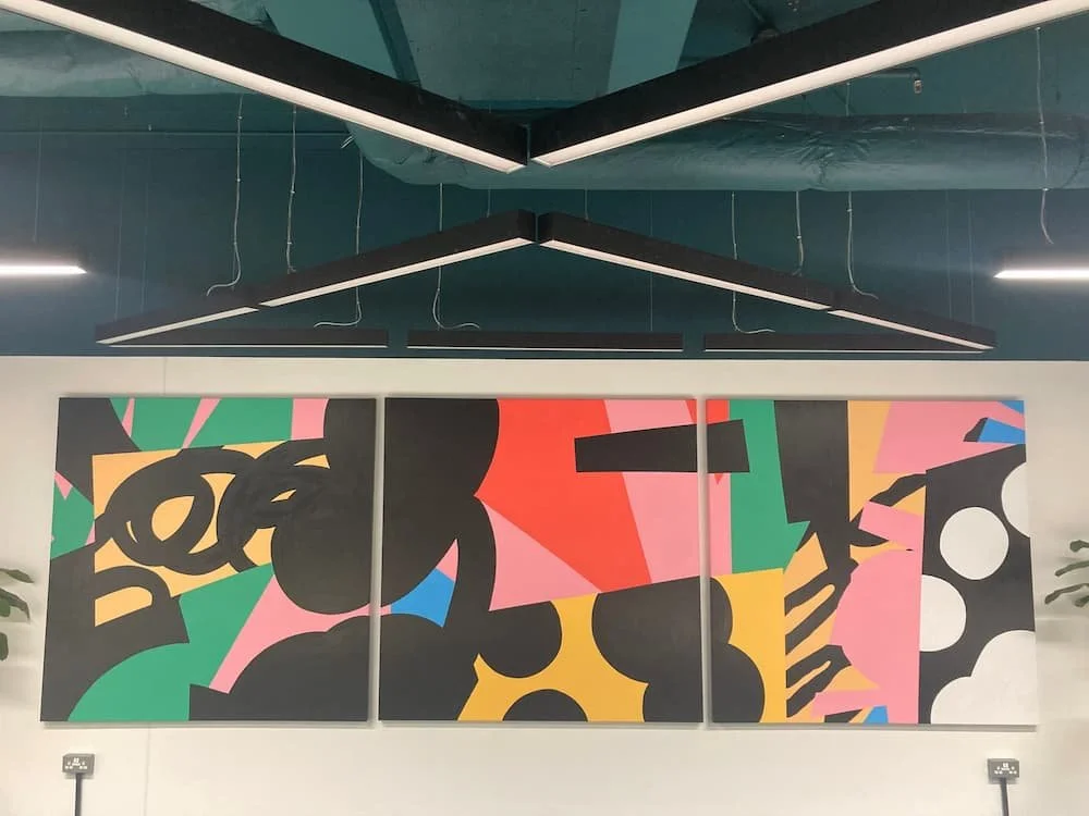 Professional art installation by Gilbert Art Services in a an office building near Canary Wharf