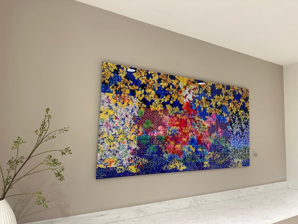 Professional picture hanging by Gilbert Art Services in Marylebone office.