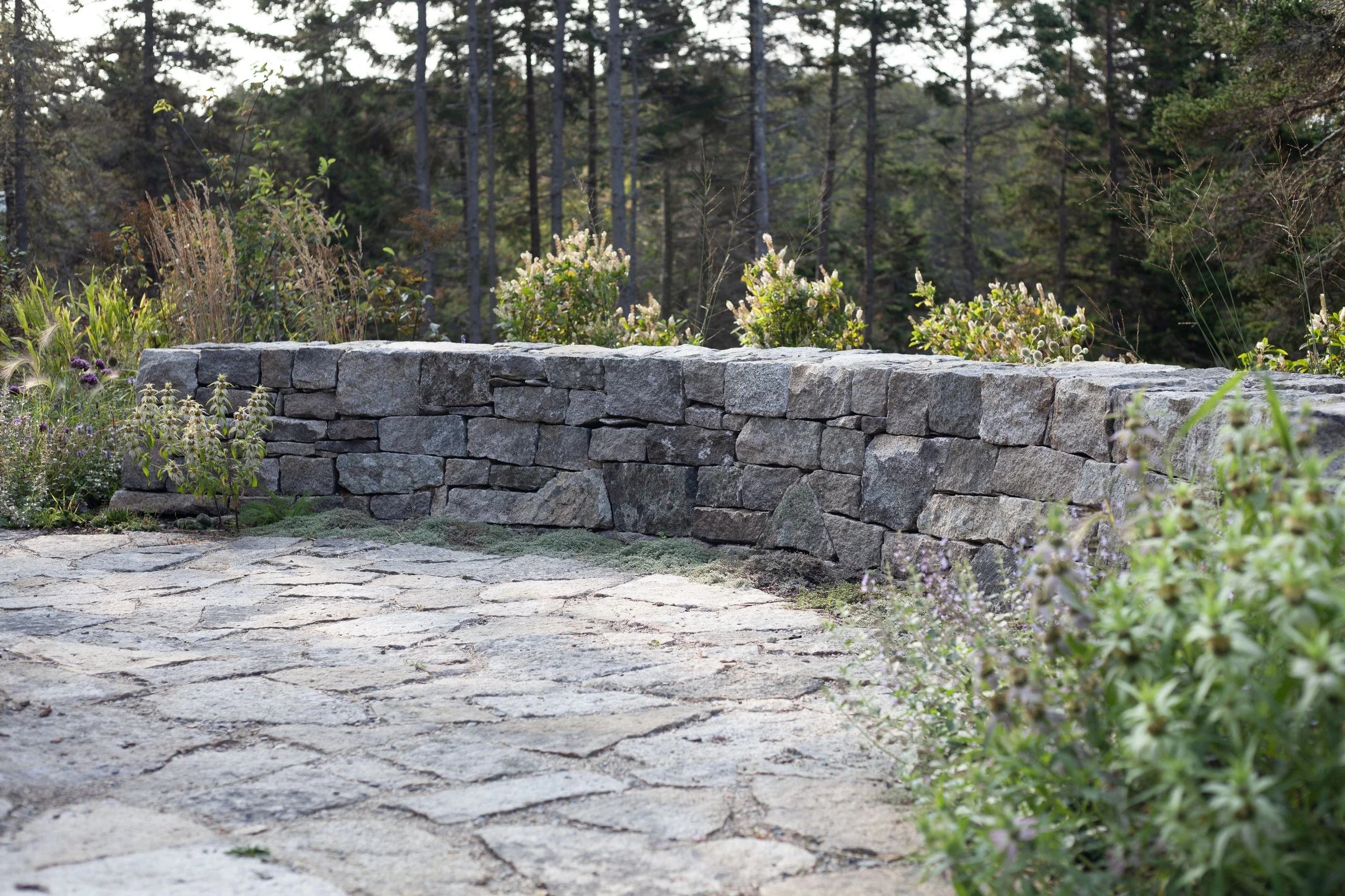 Weathered granite, collected on site, heightens the sense of place with fine craftsmanship and simple materials.