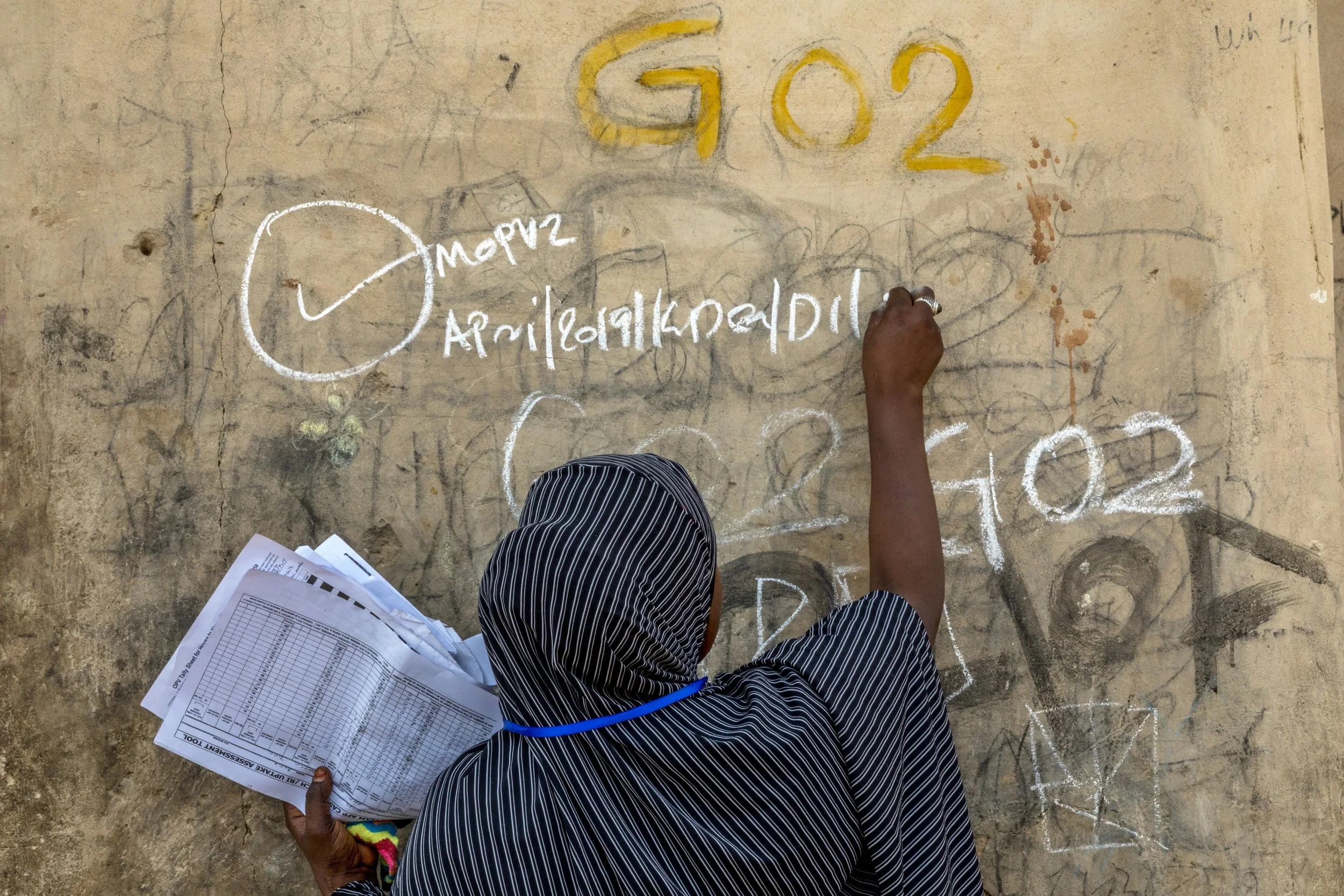  A health worker participates in a door-to-door polio immunization campaign Internally Displaced Persons camp in Nigeria.  