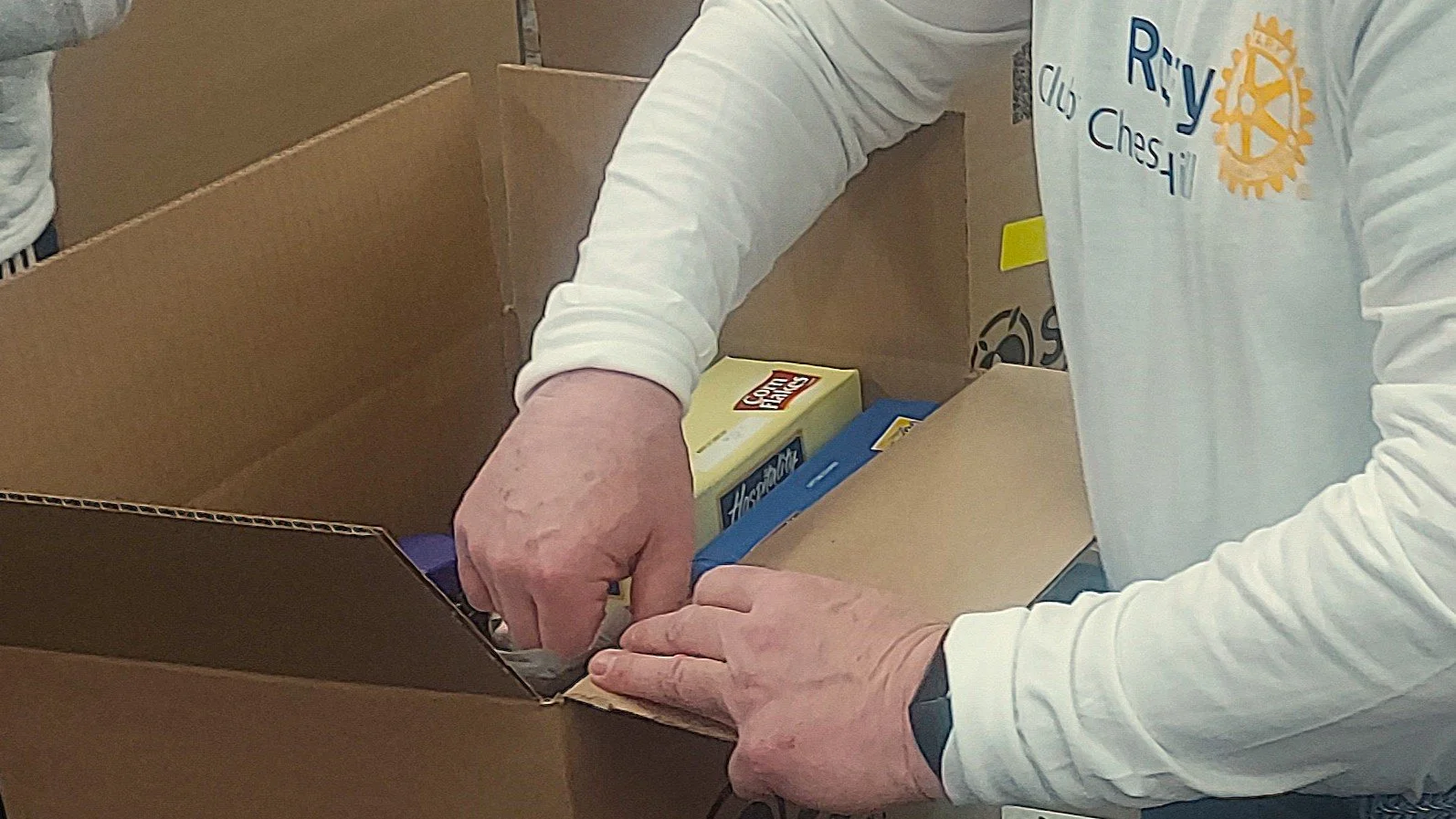 Volunteers packing Food for seniors in need at Share Food Program