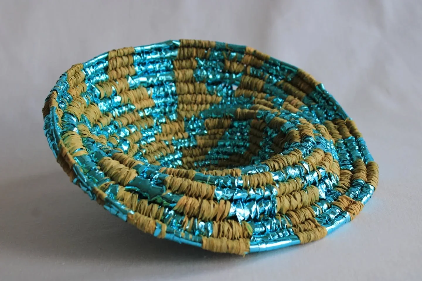 Earth Bowl, 2025
#textiles #basketry #raffia #coiledbasket #cellophane #urbanforaging