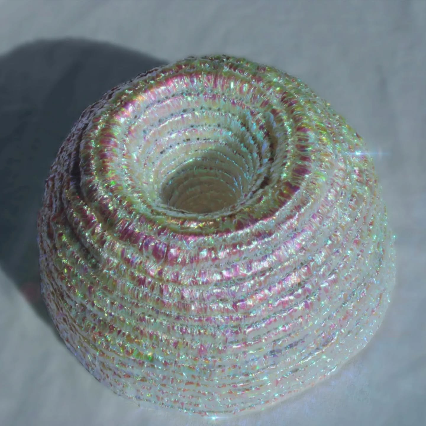 Inverted Black Hole, 2025

Coiled form made from iridescent cellophane
#textileart #basketry #coiledbasket #art #textileartist #textiles
