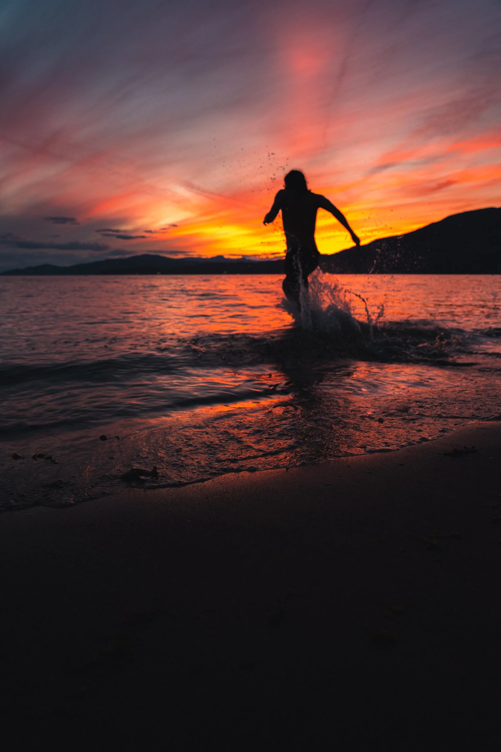 Man Swimming Sunset Beach Vancouver.jpg