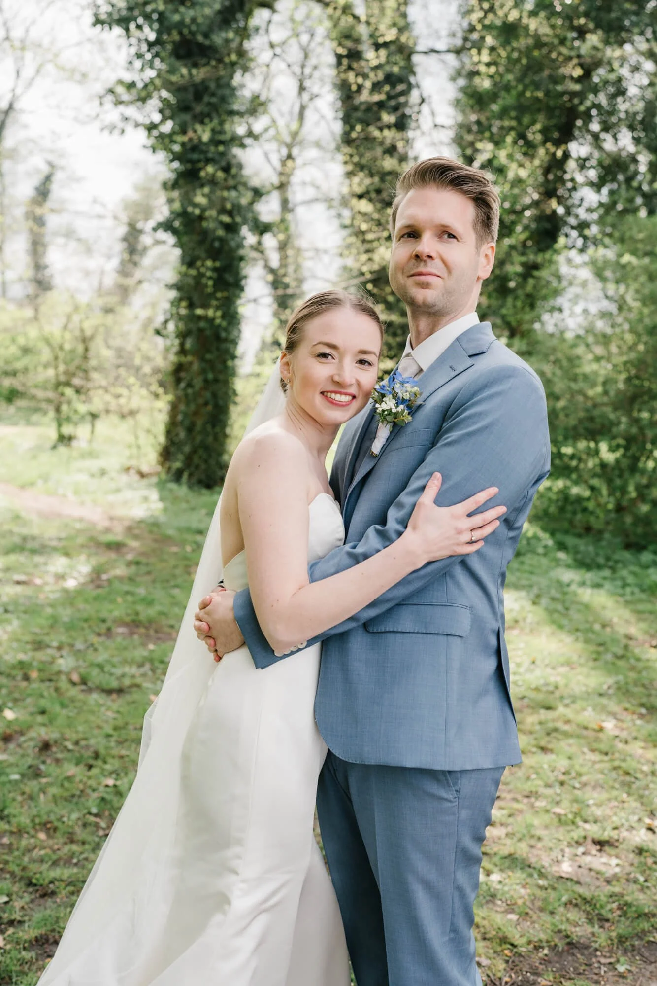 wedding couple looking trough wedding photographer