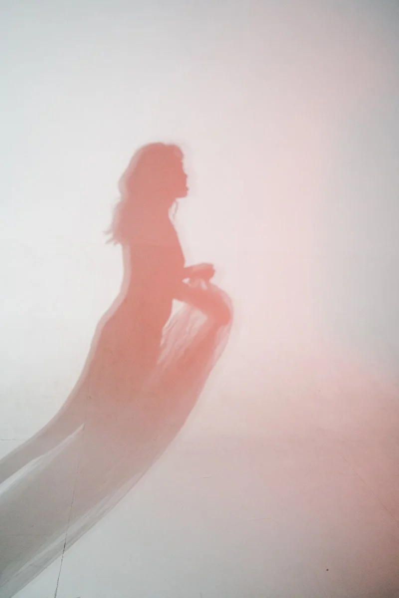 Art photographer in Munich capturing red shadow of a model