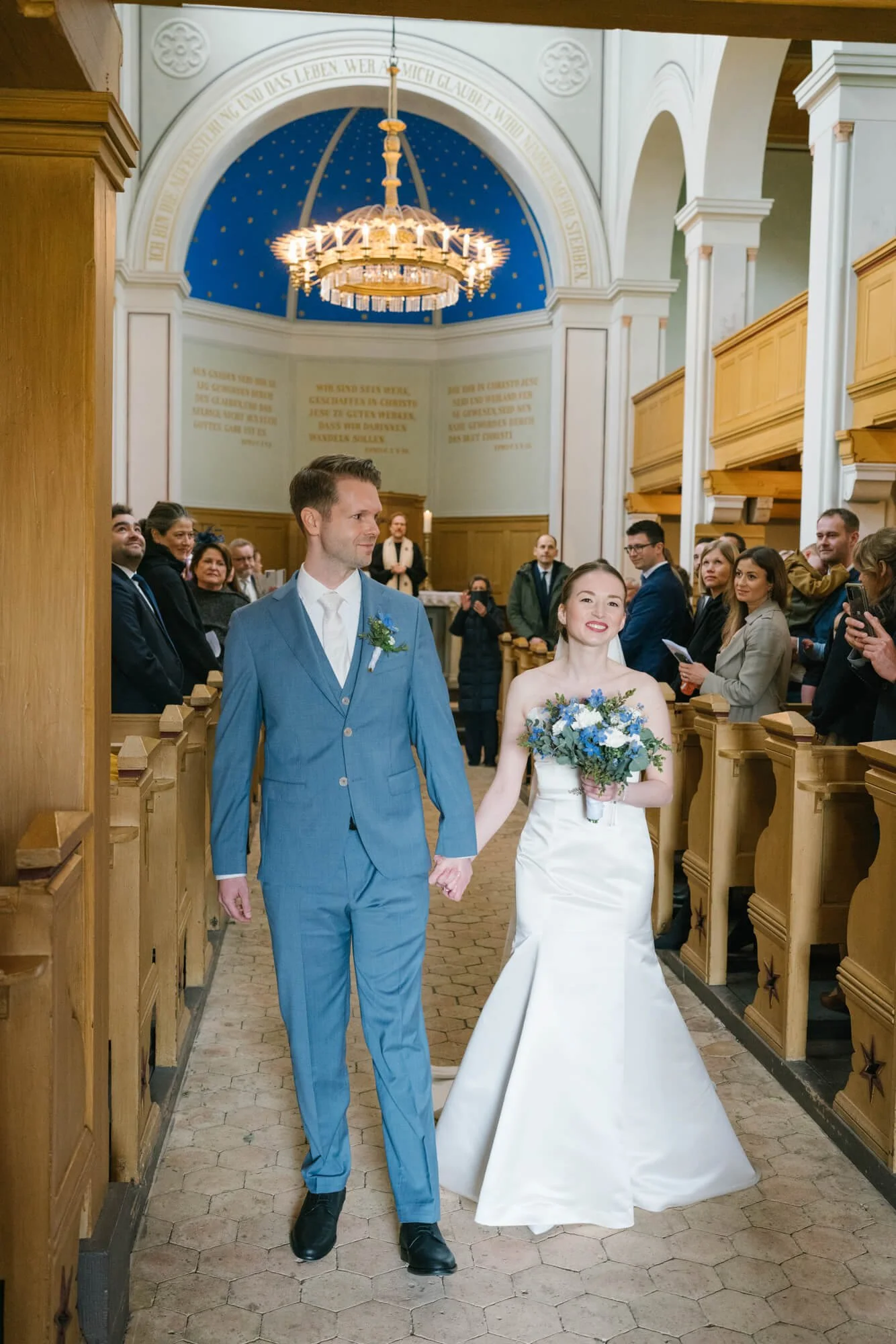 wedding couple is exiting Dorfkirche Caputh