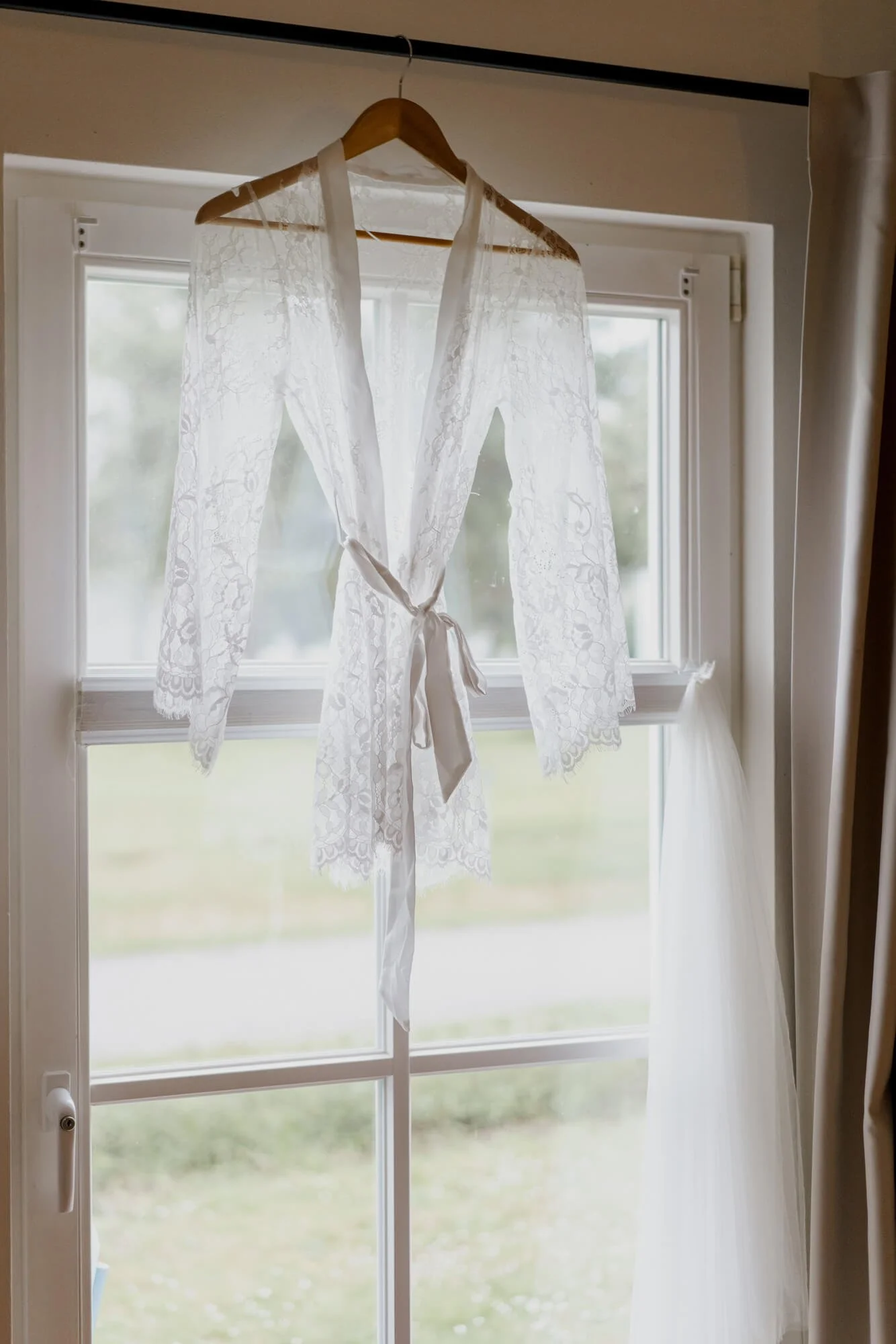 Bridal morning outfit hanging on the wedding venue