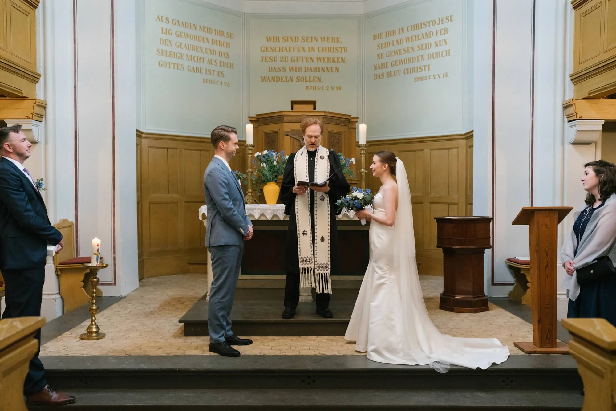 wedding couple standing during ceremony in Dorfkirche Caputh