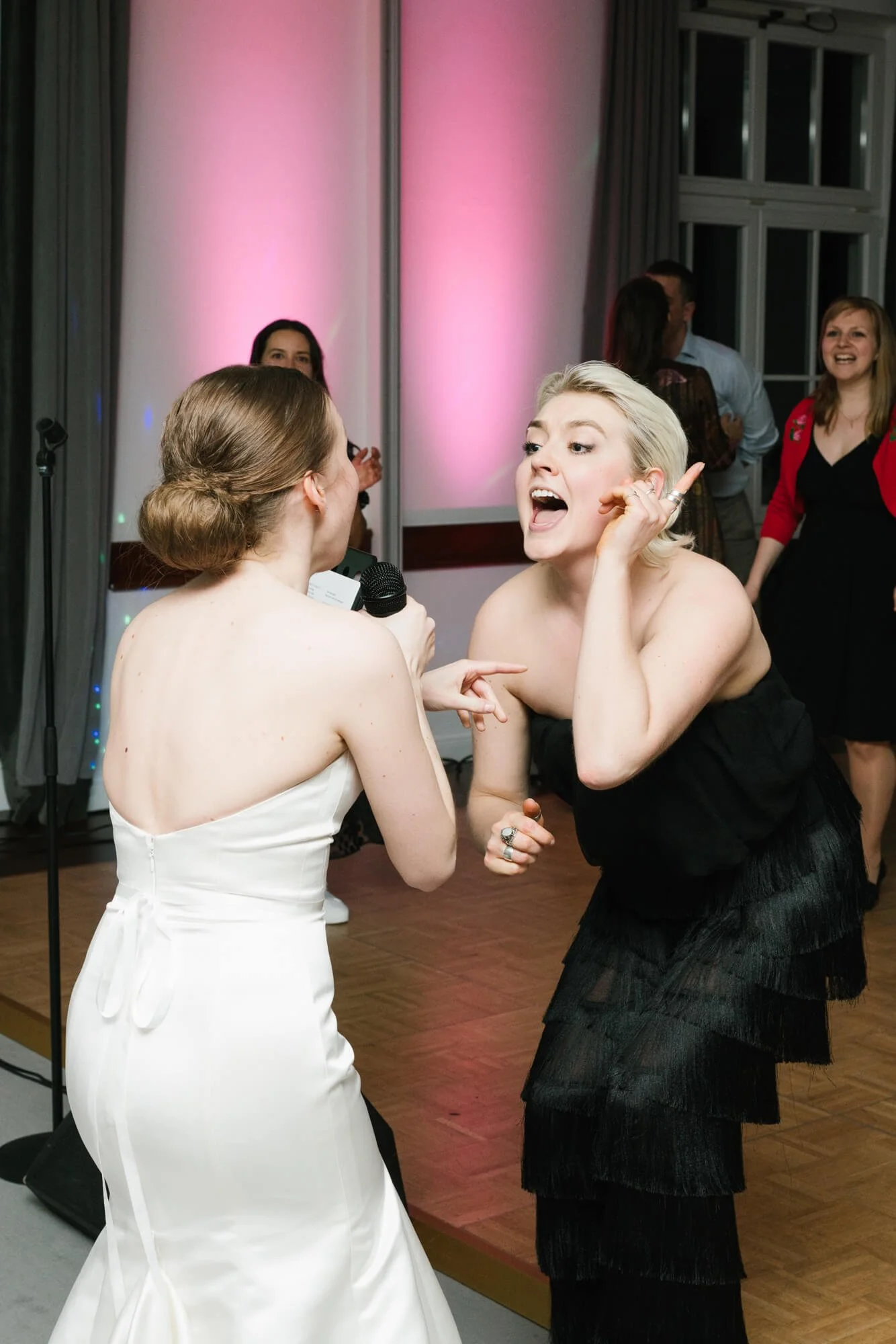 bride from the back with happy guest
