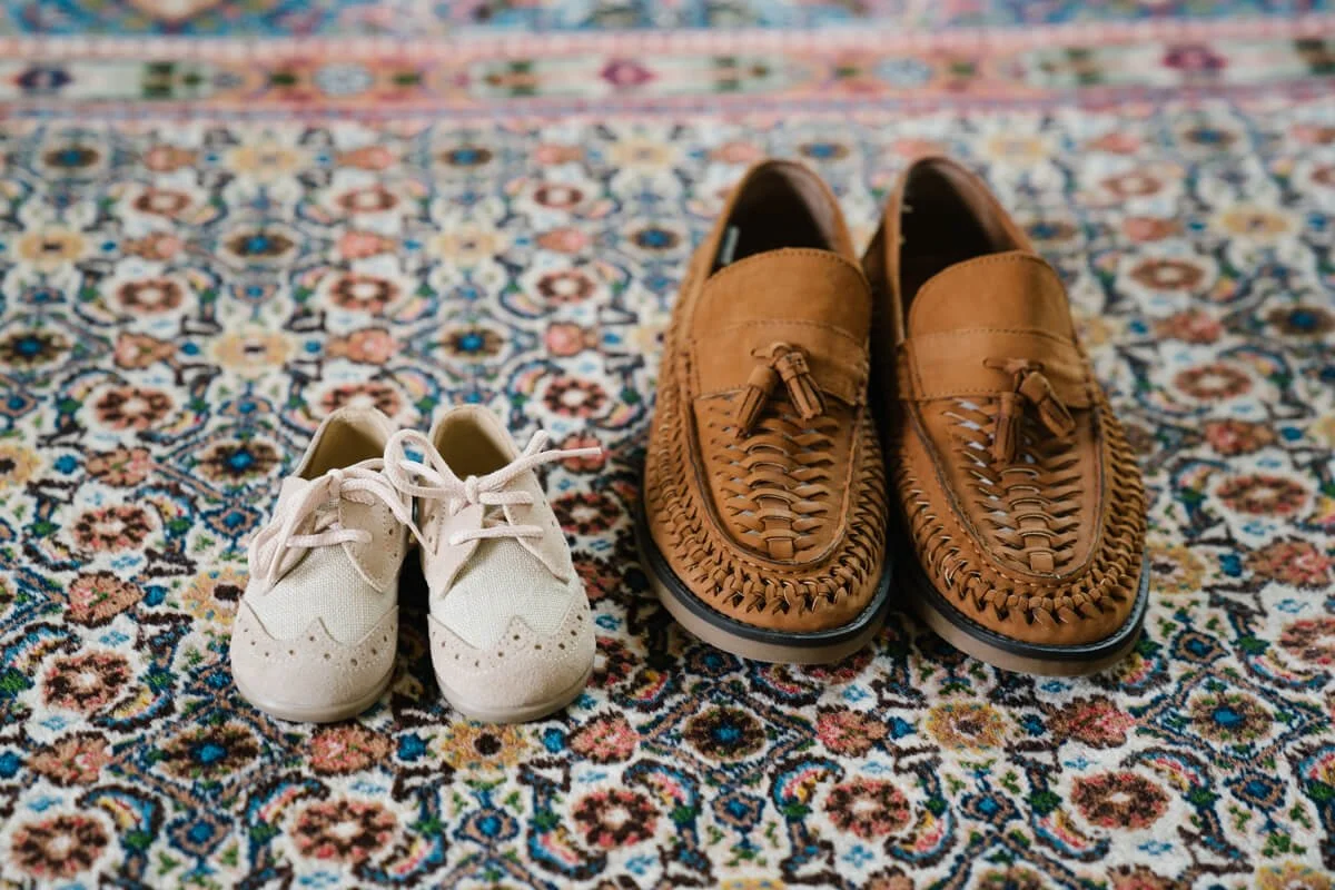 Groom shoes together with his son's shoes. Very cute different sizing