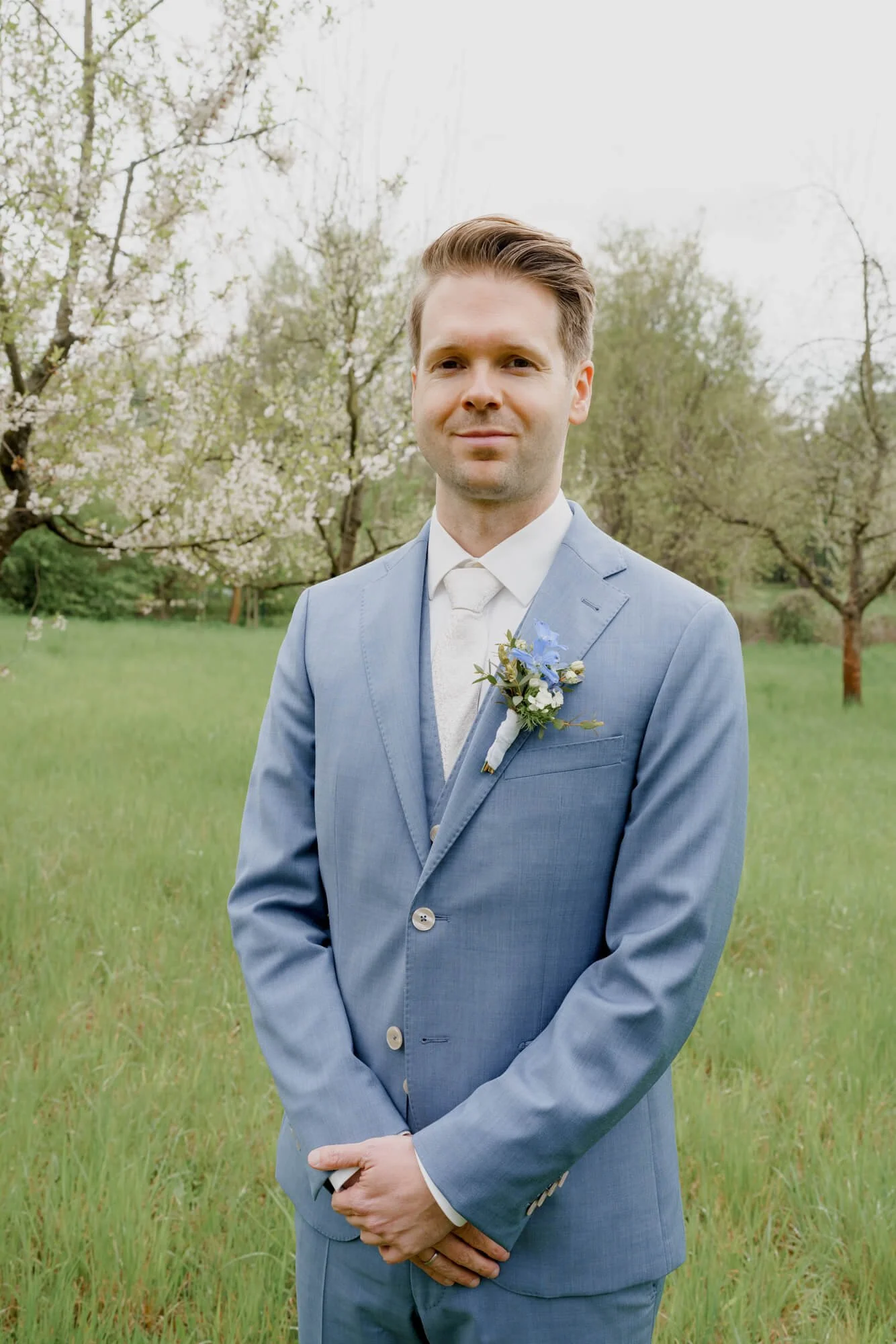 groom in blue wedding suit