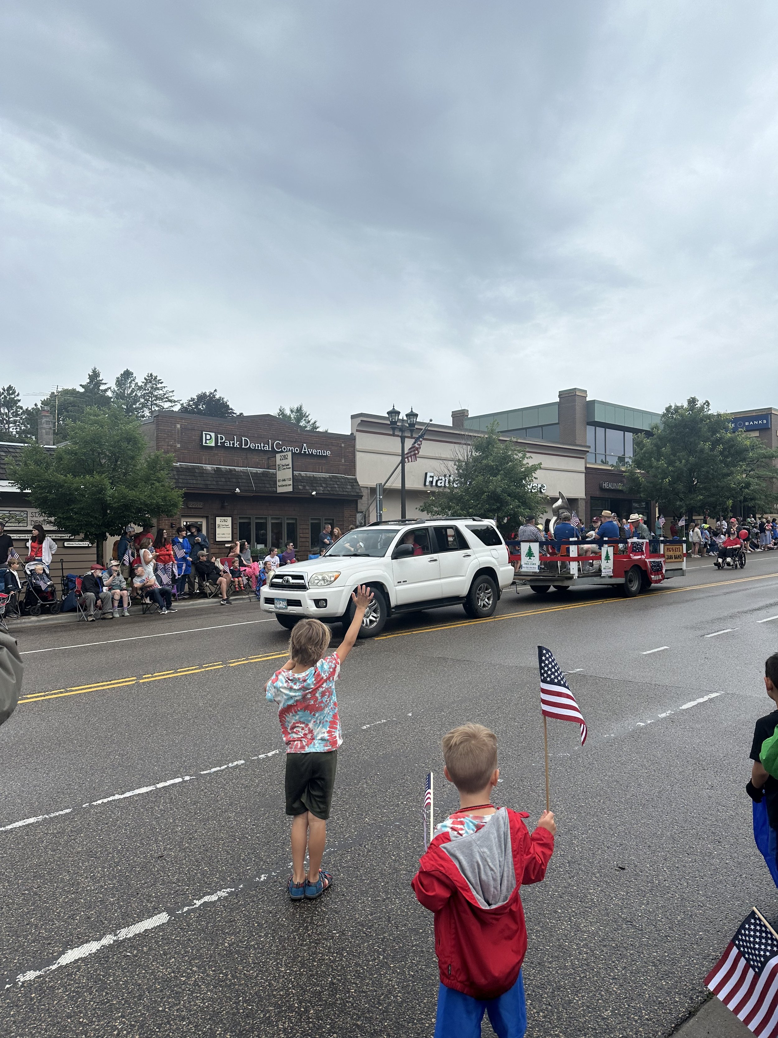 Hailing for candy at the July Fourth parade