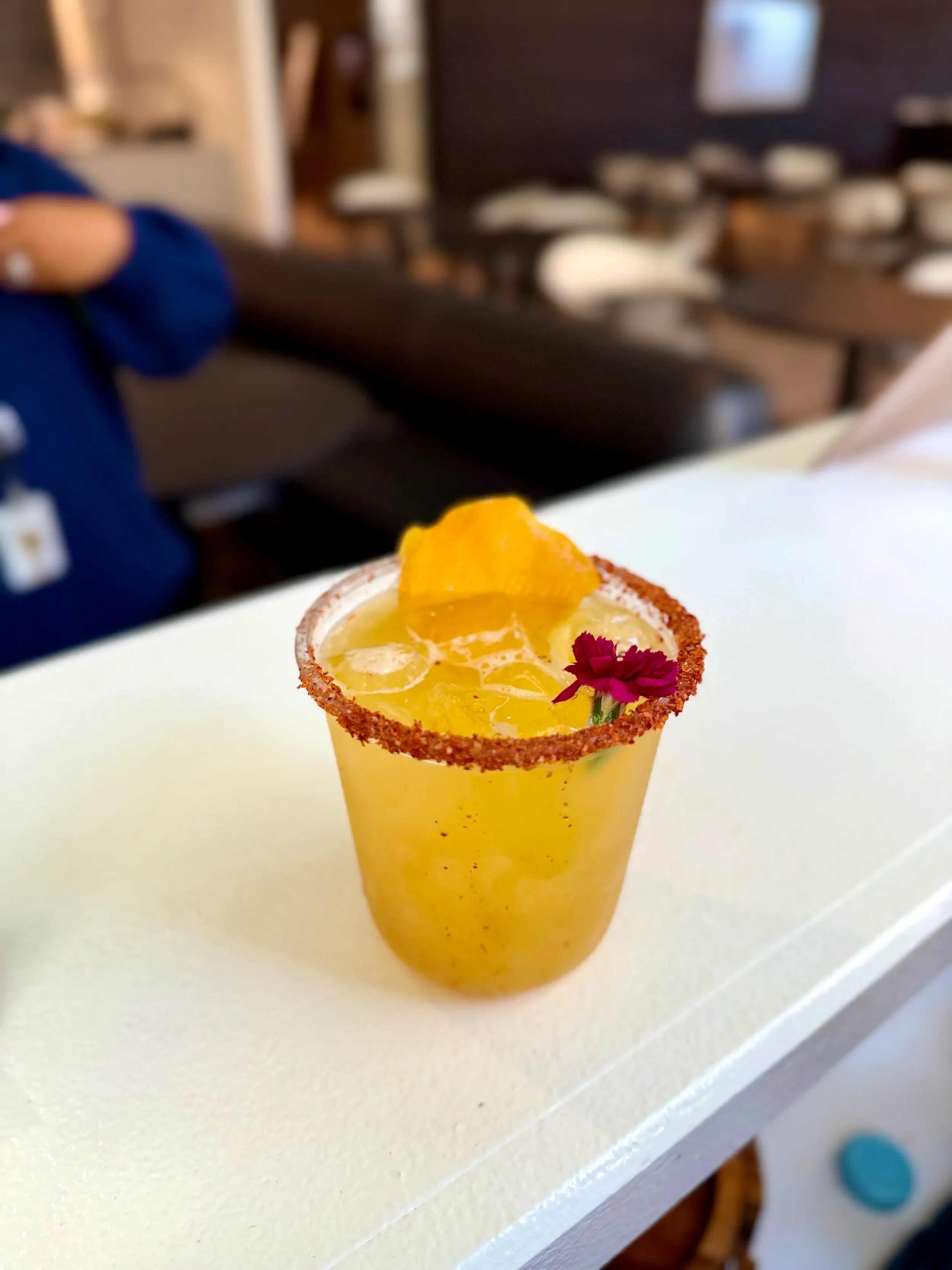 Handcrafted mango mocktail margarita with Tajín garnish, created for an On Cloud Lime corporate employee appreciation event in Orlando.
