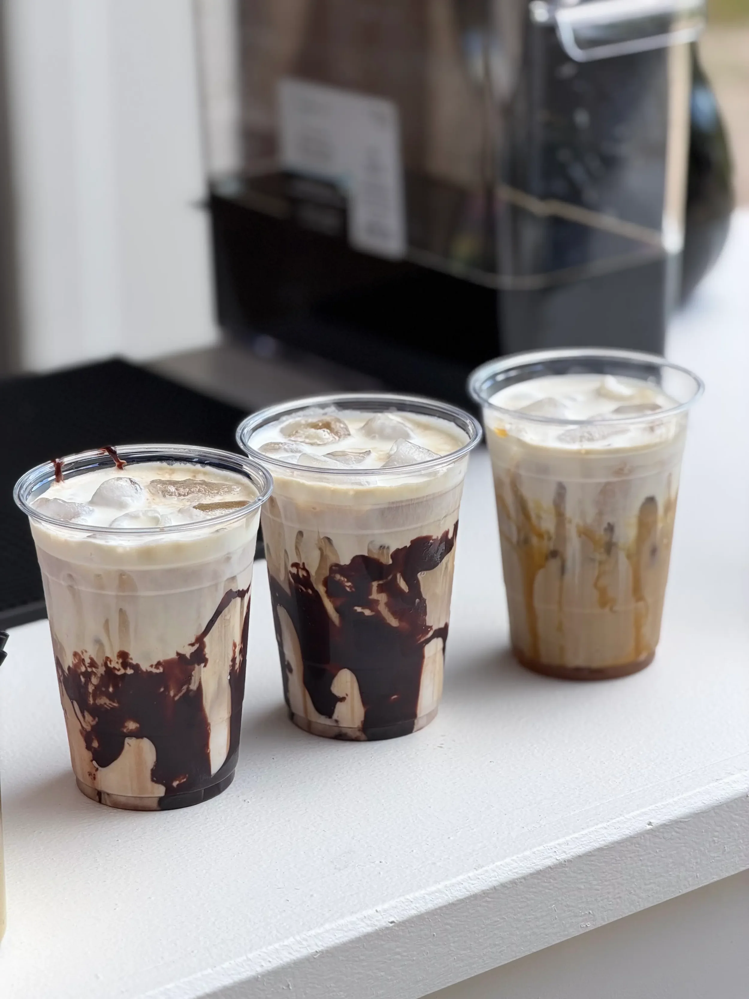 Luxury coffee display showcasing specialty mocha and caramel lattes with premium presentation for weddings, corporate events, and private celebrations.