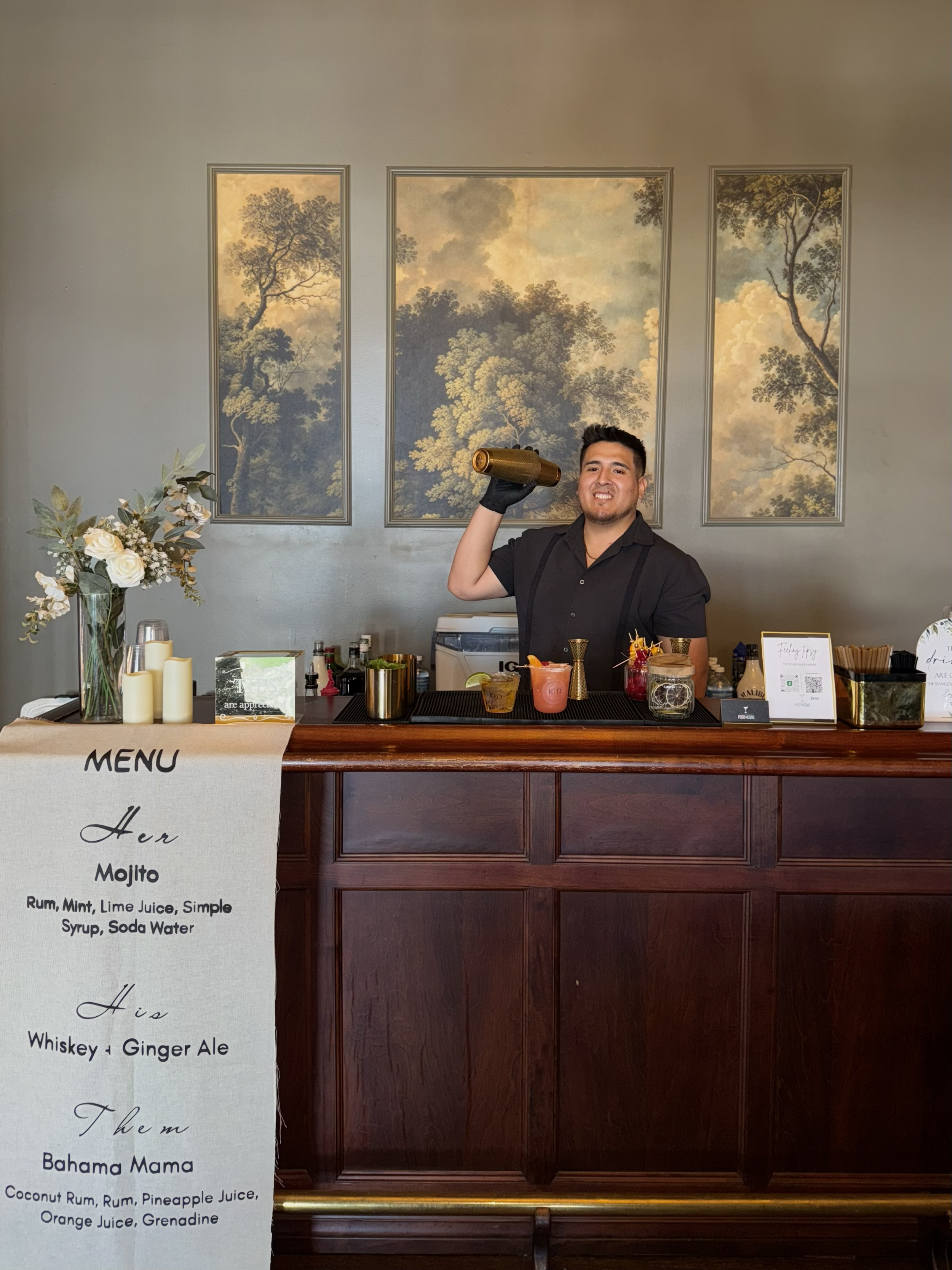 Owner of Pisco Mixers Mobile Bar in Orlando holding a shaker smiling at the camera