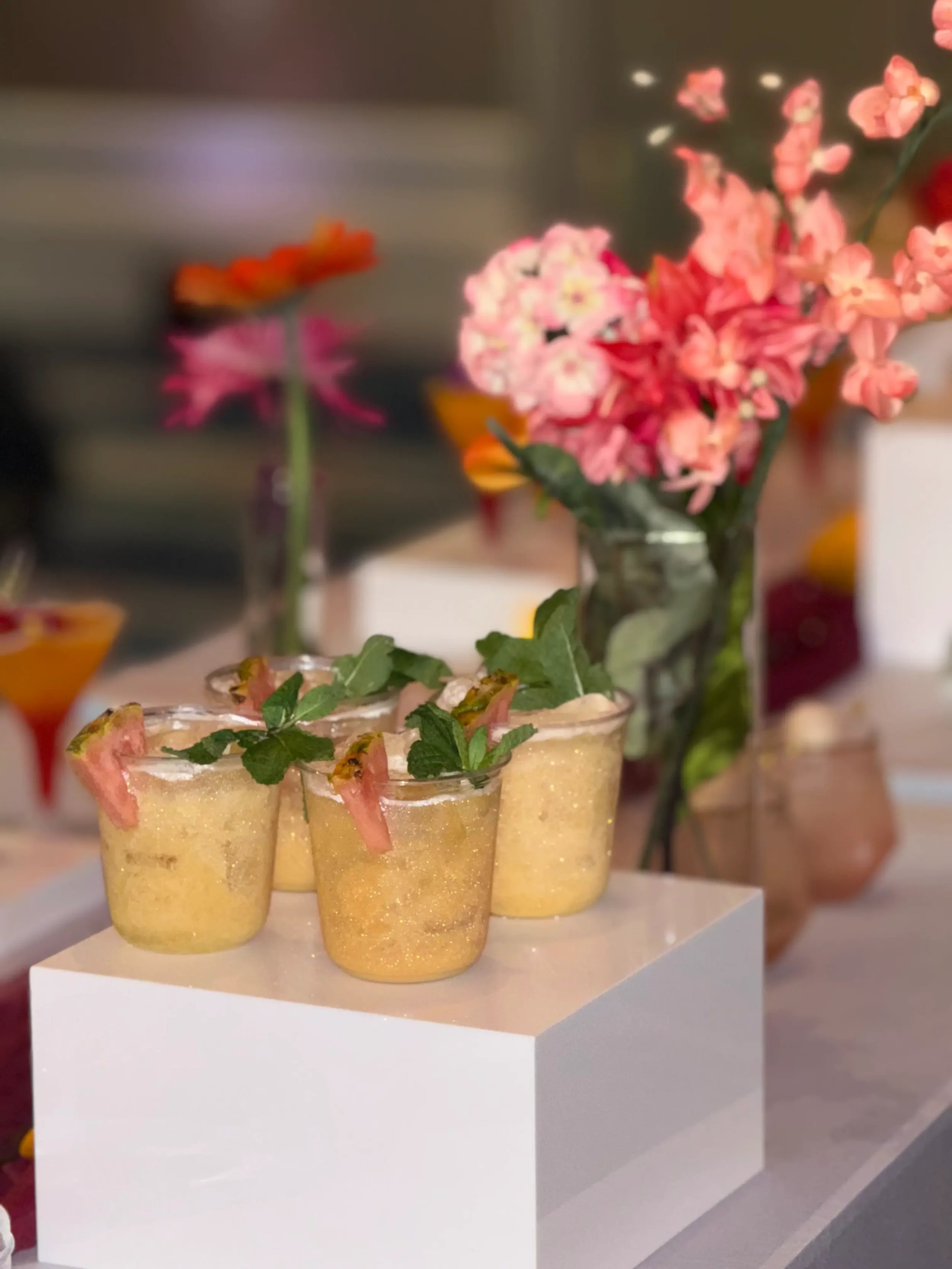 Luxury mocktail display featuring a piña colada  mocktail presented on elegant risers as a premium mobile bar enhancement by Pisco Mixers.