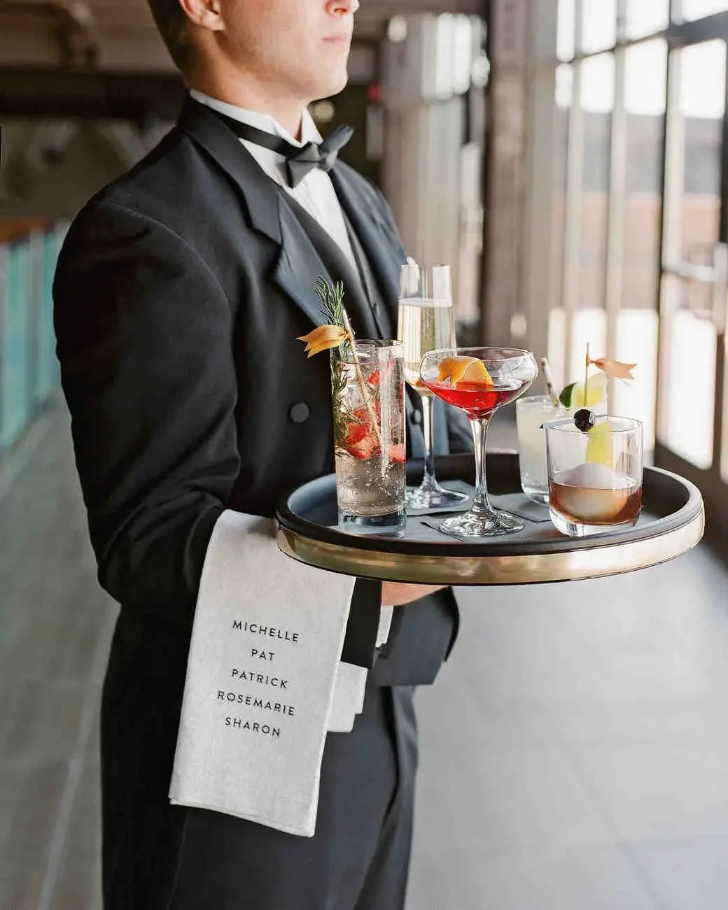 Professional event servers providing guest service during a wedding, corporate event, and private celebration in Orlando as part of our additional event staffing services.