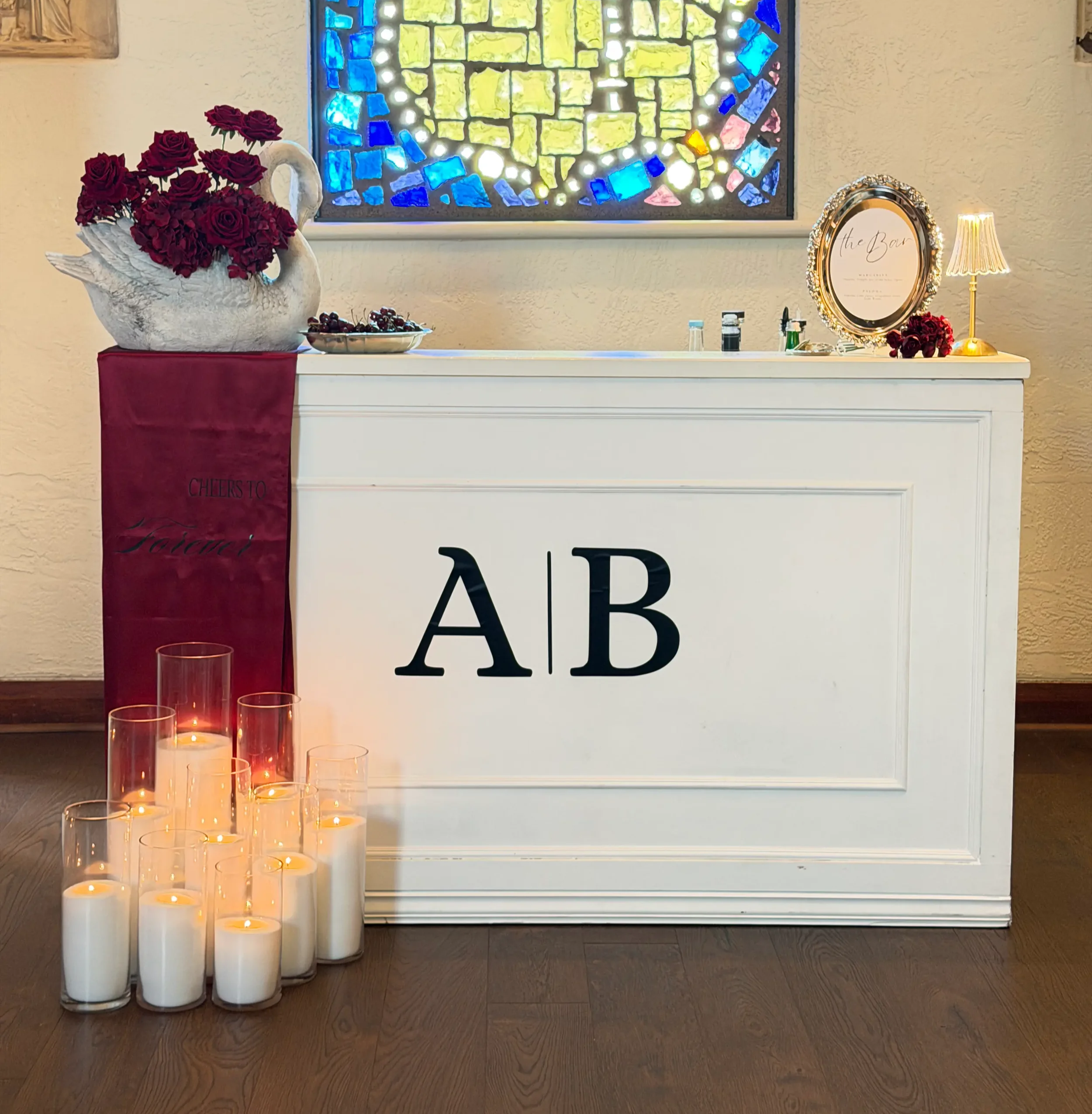 Orlando Wedding Mobile Bar with a themed customized bar with couple's initials, flower arrangements, candles, custom menu and decor.
