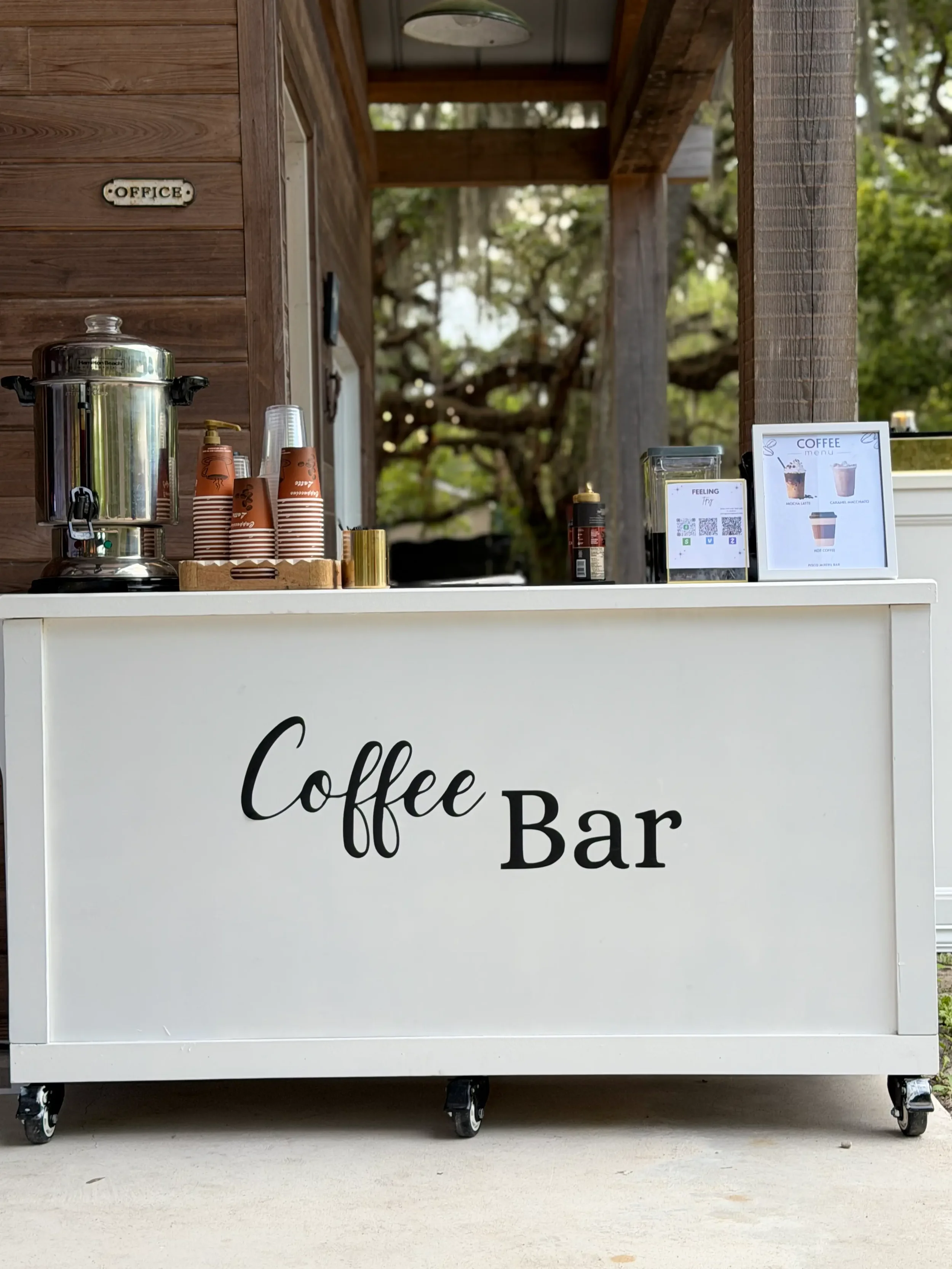 Luxury coffee cart featuring a complete setup with espresso drinks, premium syrups, milk options, toppings, and elegant styling for weddings and corporate events by Pisco Mixers.
