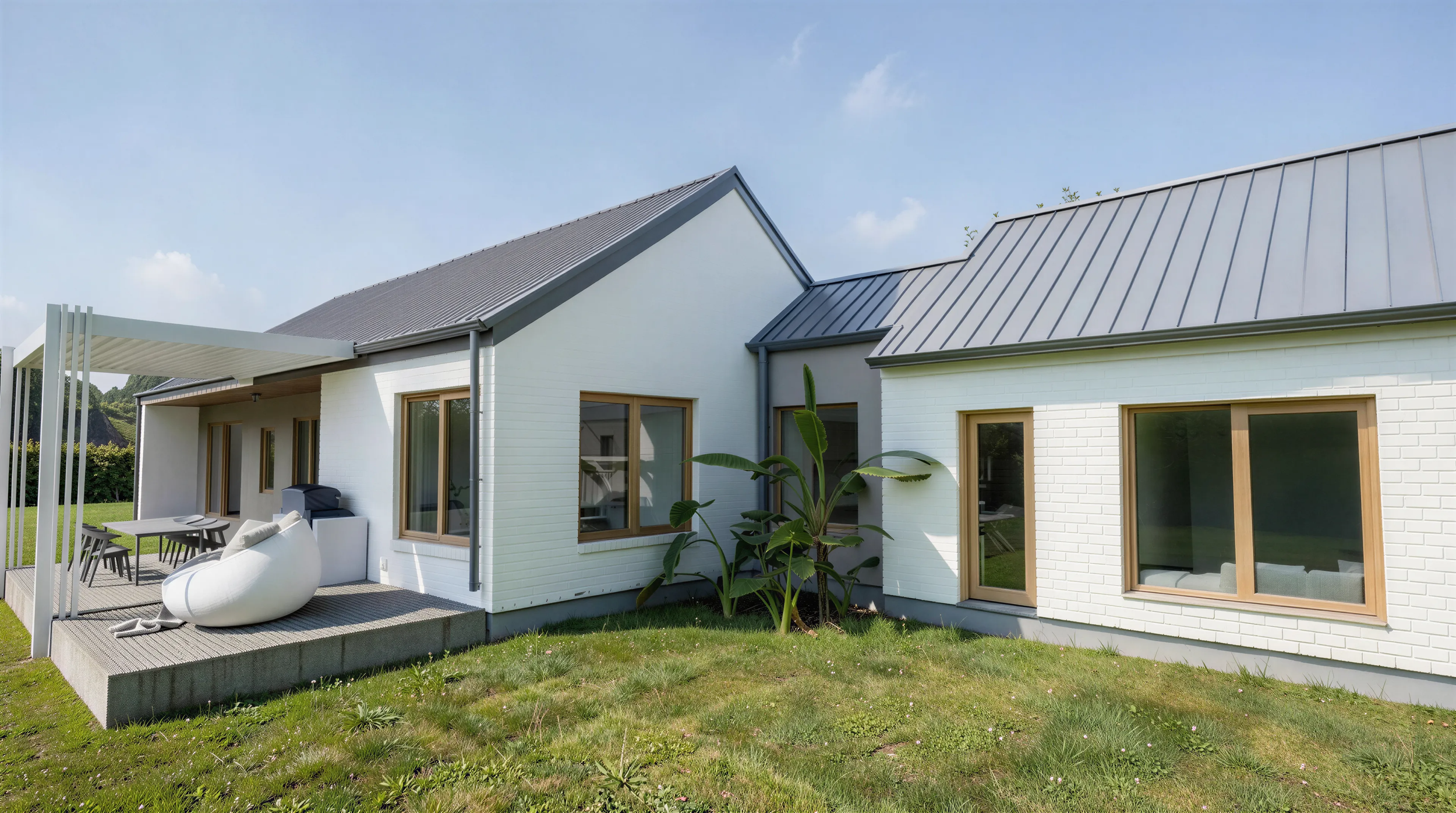 Angled exterior of a white gabled three bedroom rural home designed for energy efficiency and comfort
