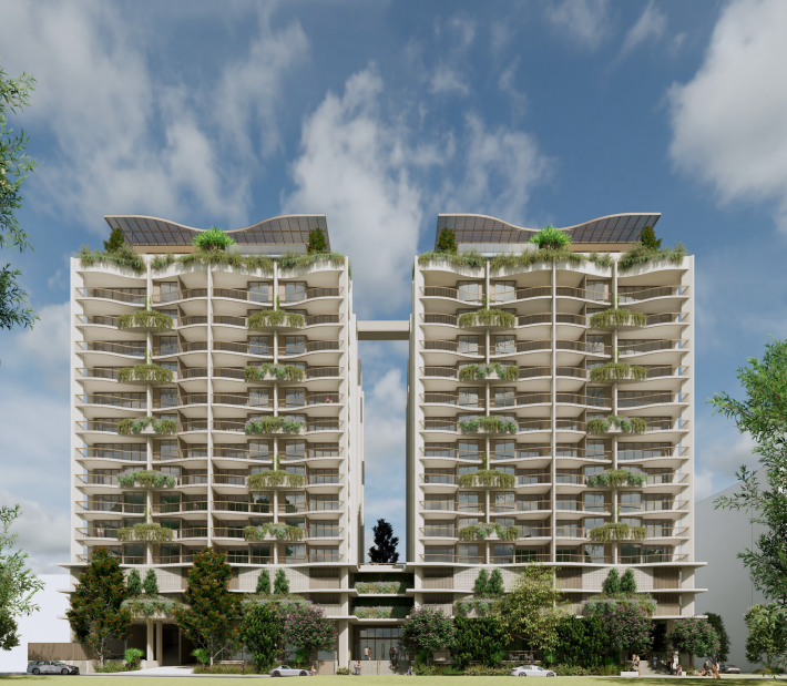 Modern twin high-rise apartment buildings with curved balconies and green rooftop gardens, connected by a skybridge, under a partly cloudy sky.