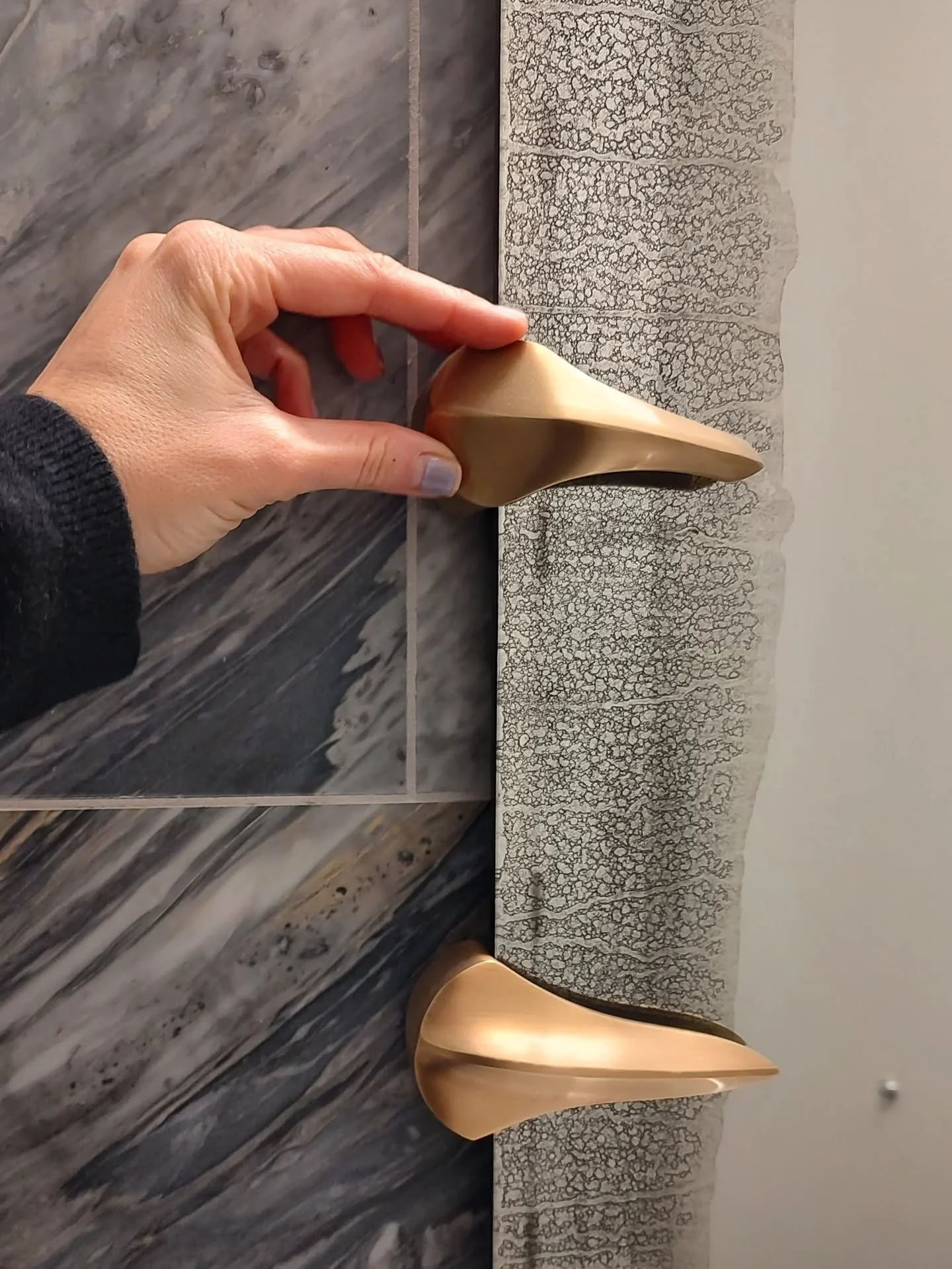 Check out this cool mirror we just had installed in this residential powder room! It has these little brass talons clutching antique mirror class! I have been wanting to install this for years now in the right space. Looks extra spooky against the dr