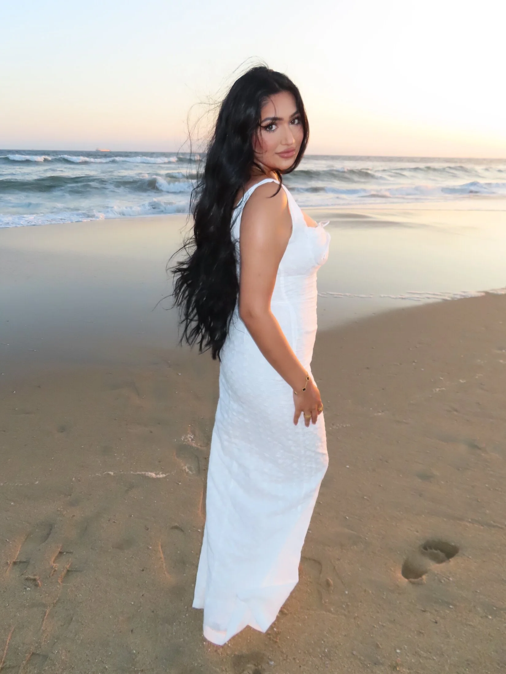 Soft, timeless hair and makeup by Glam by Manpreet, photographed at the beach.