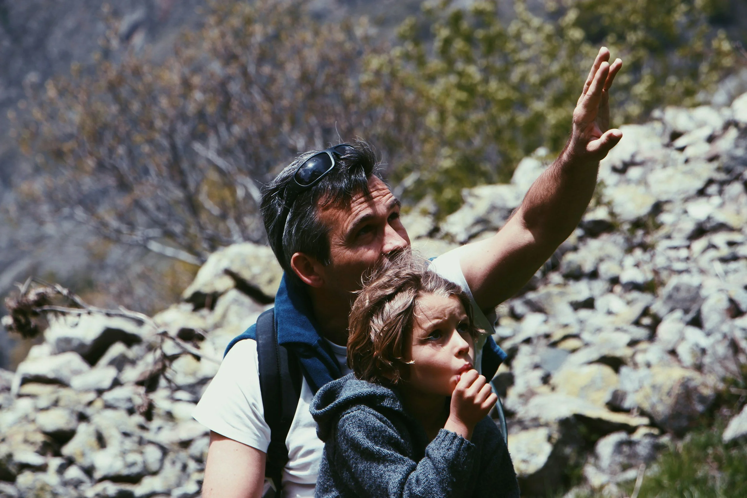Parent and child hiking together outdoors