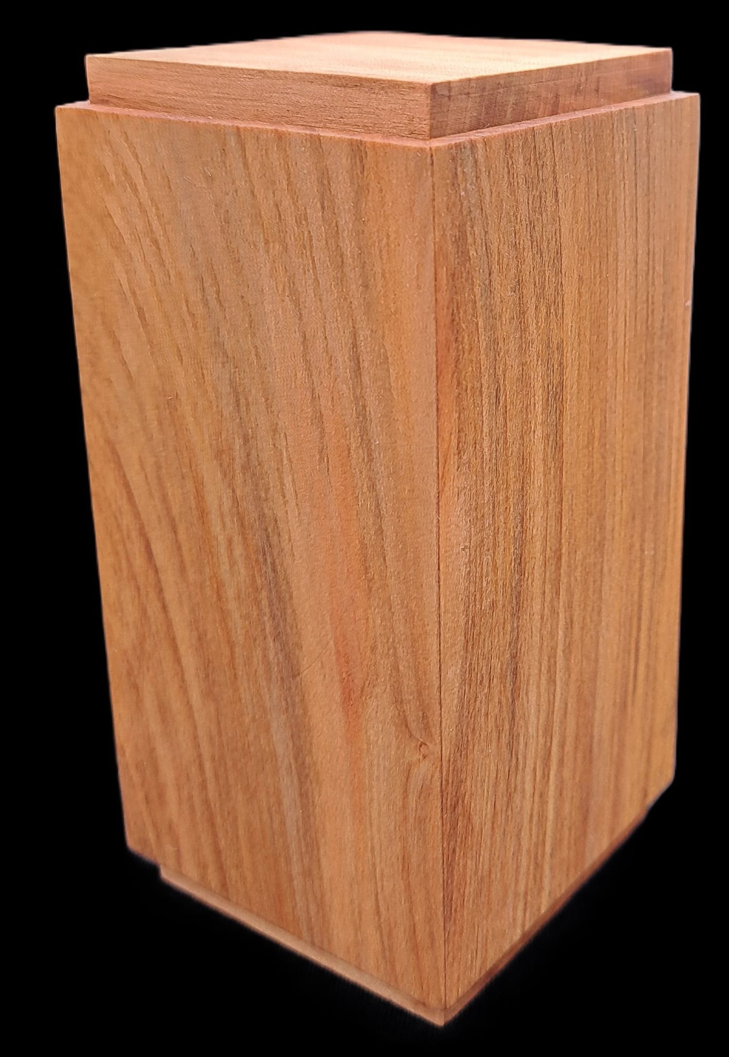 A rectangular wooden box with a sliding lid on top, made of light-colored wood with visible grain.