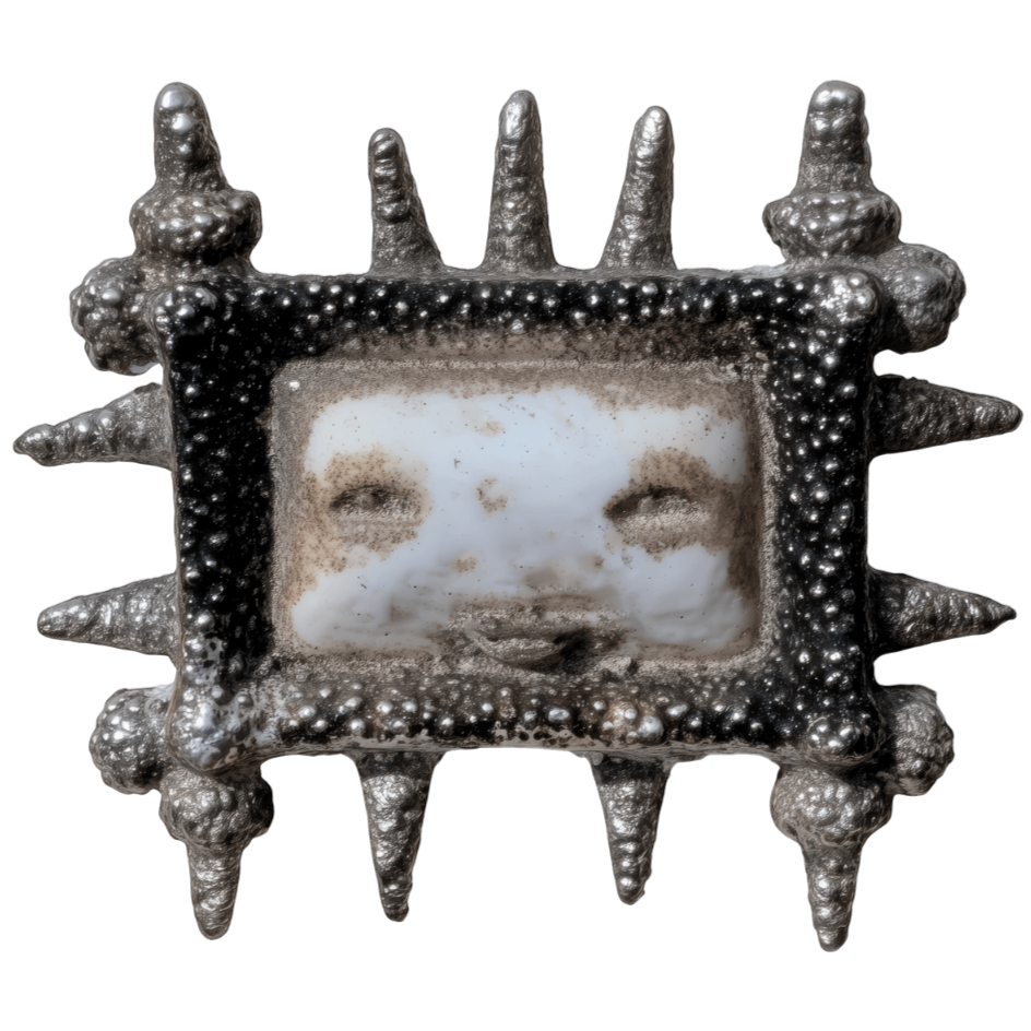 A metallic star-shaped object with spikes on each point, featuring a vintage black-and-white photograph of a smiling child's face in the center.