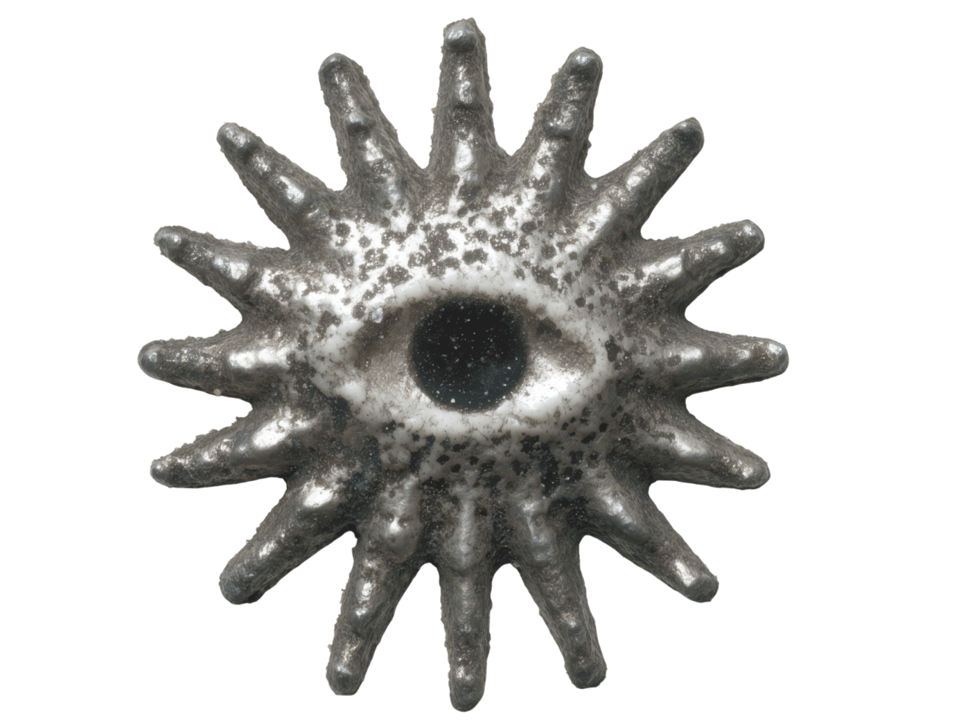 A star-shaped object with an eye in the center, metallic surface, and textured with black and white speckles.